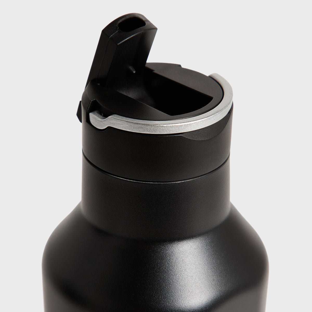 Close-up of the flip-top spout and lid mechanism on the Kith for Corkcicle Classic Sport Canteen