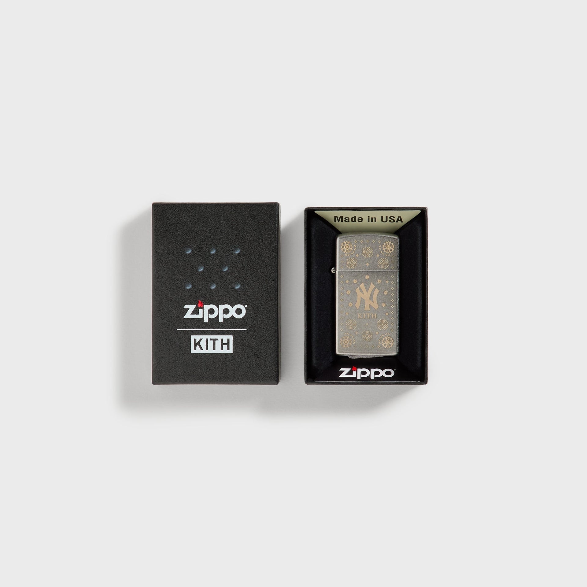 Kith x New York Yankees silver Zippo lighter displayed in open Zippo x Kith packaging box