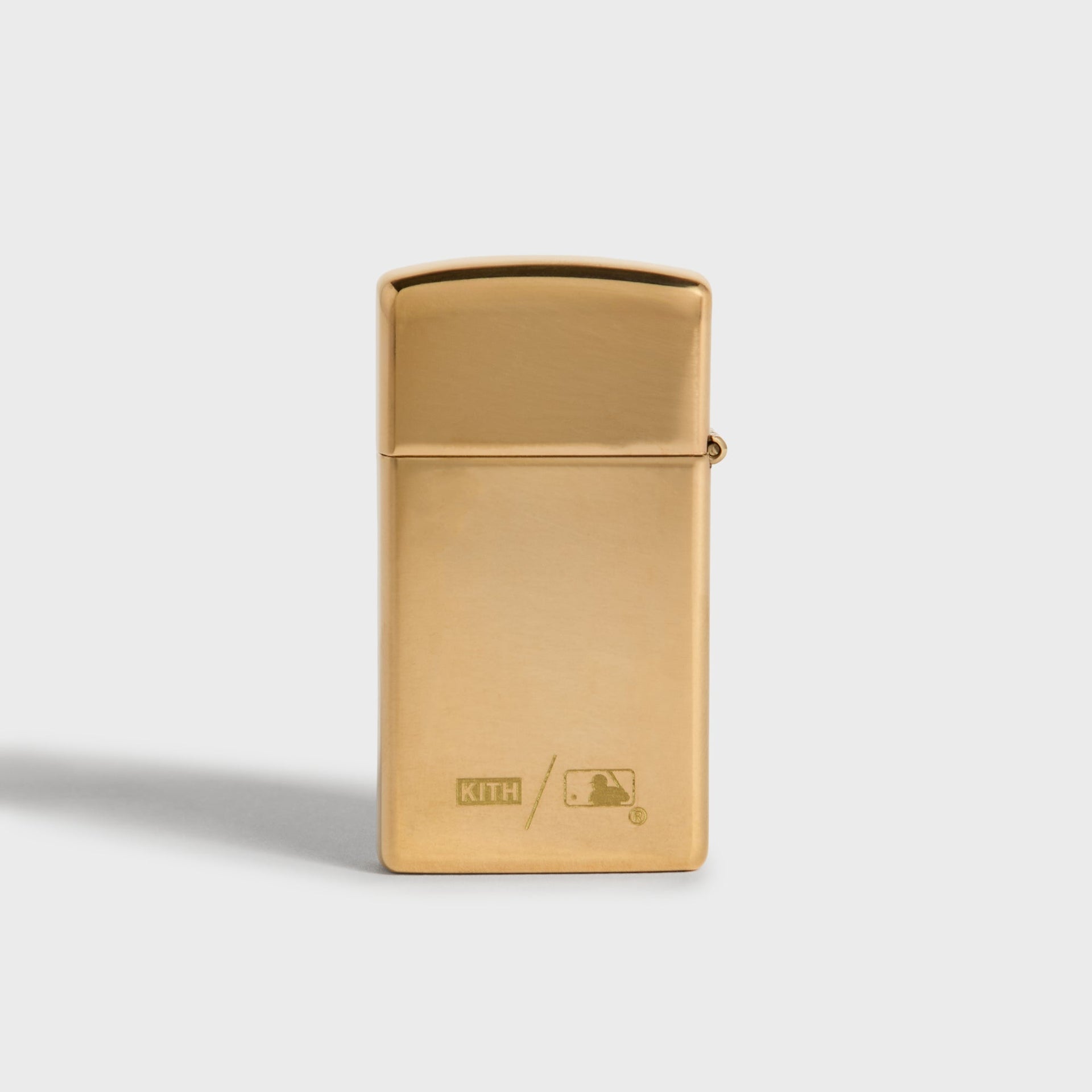 Kith x New York Yankees gold Zippo lighter, back panel with Kith and MLB logo engraved