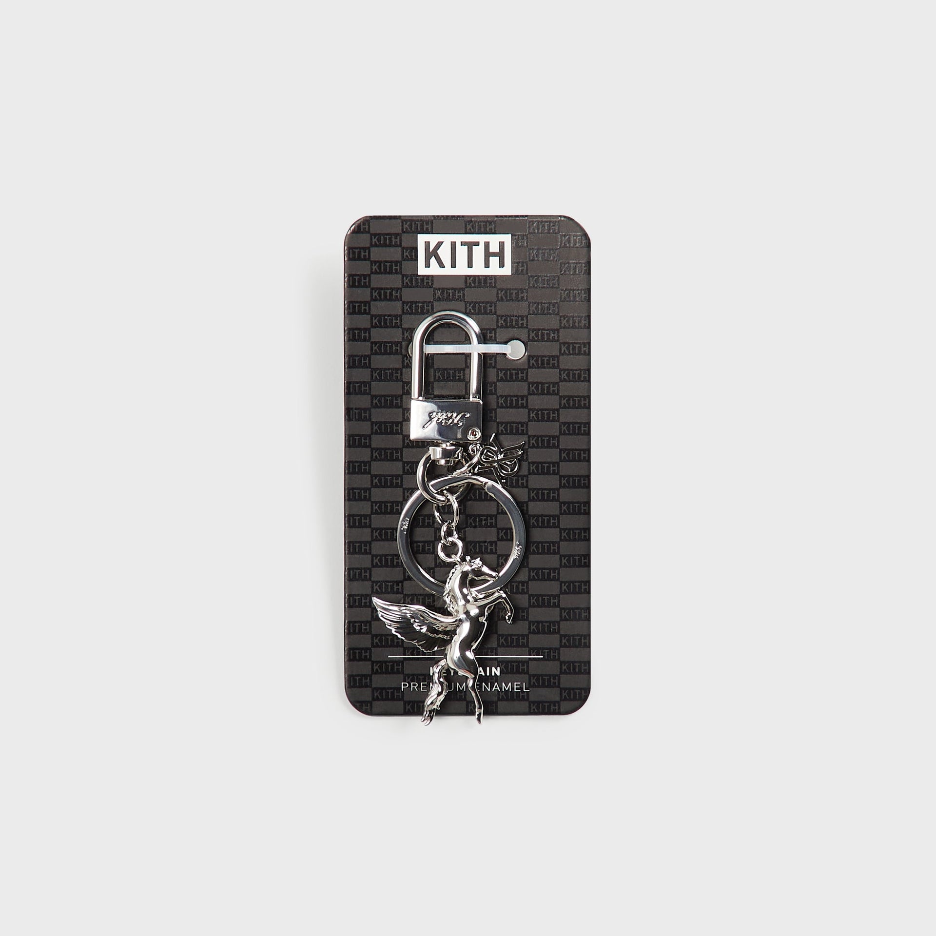 Kith Pegasus Keyring in silver displayed on its branded Kith packaging card, labeled Premium Enamel Keychain