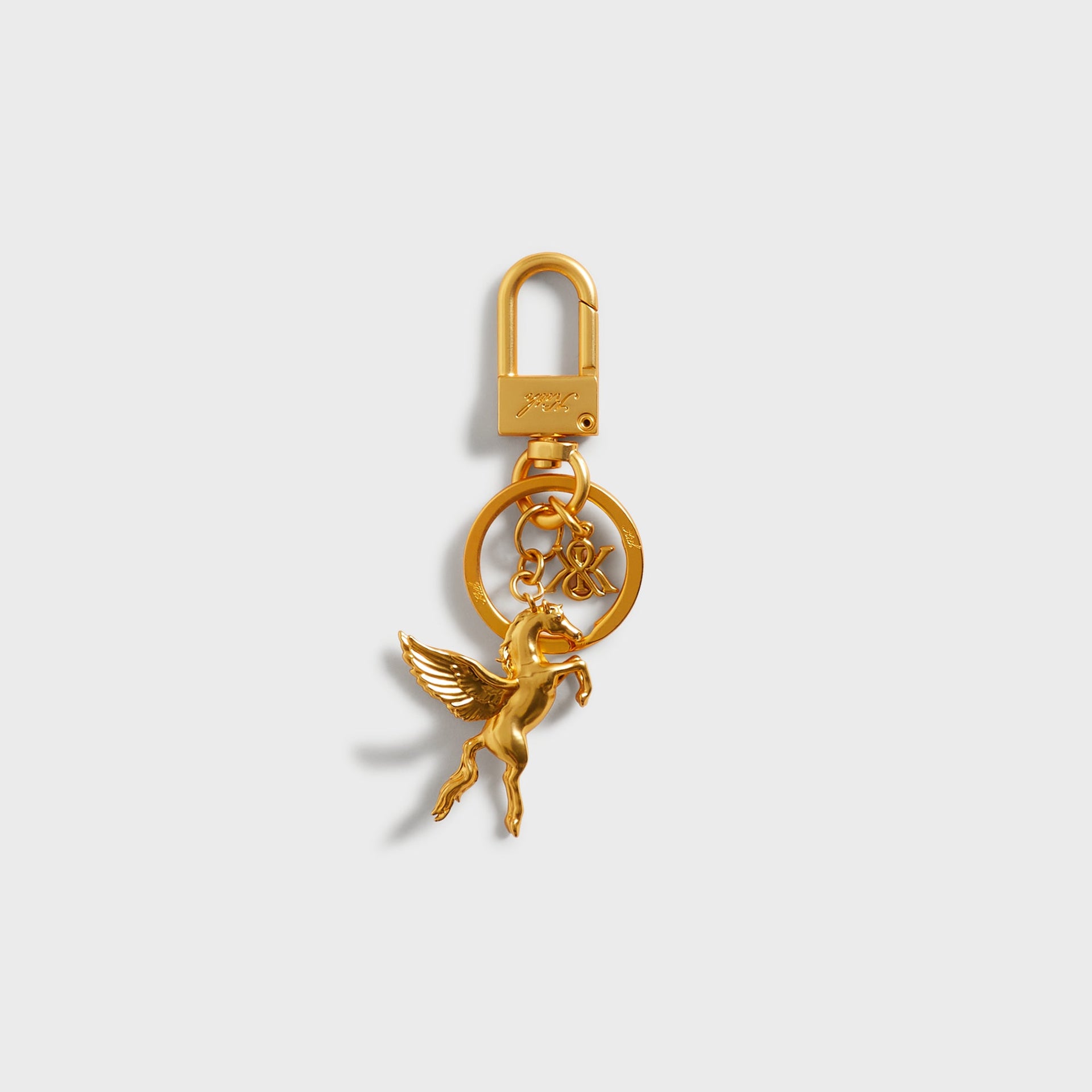 Kith Pegasus Keyring in Gold, front view with lobster clasp, key ring, and winged horse charm