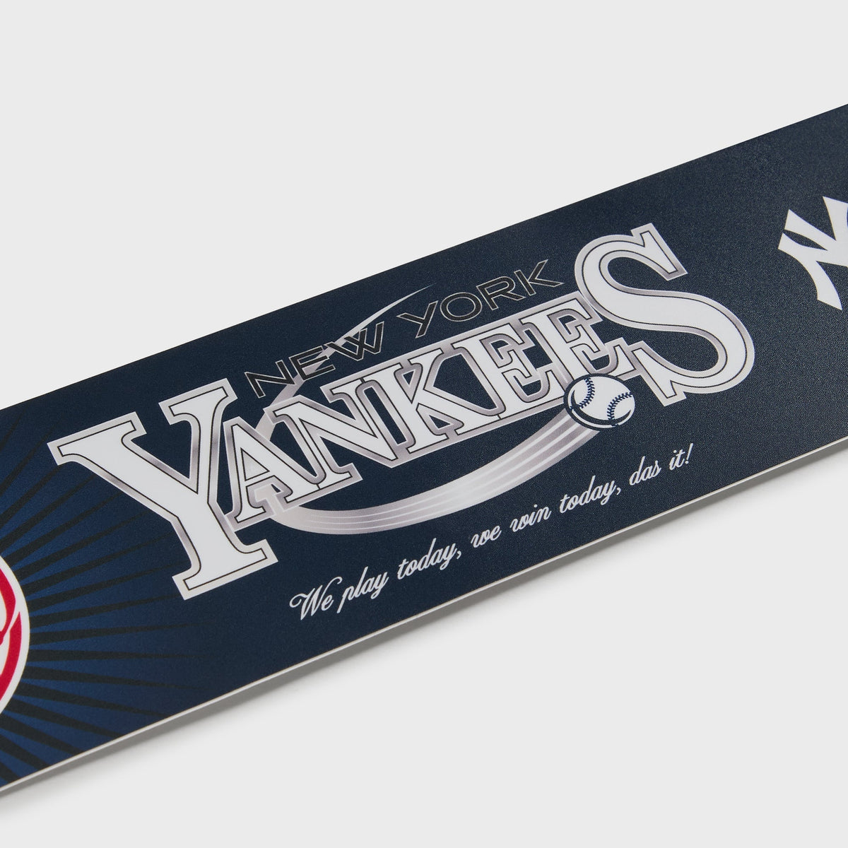 Kith for the New York Yankees bumper sticker shown at an angle, highlighting the raised silver foil lettering