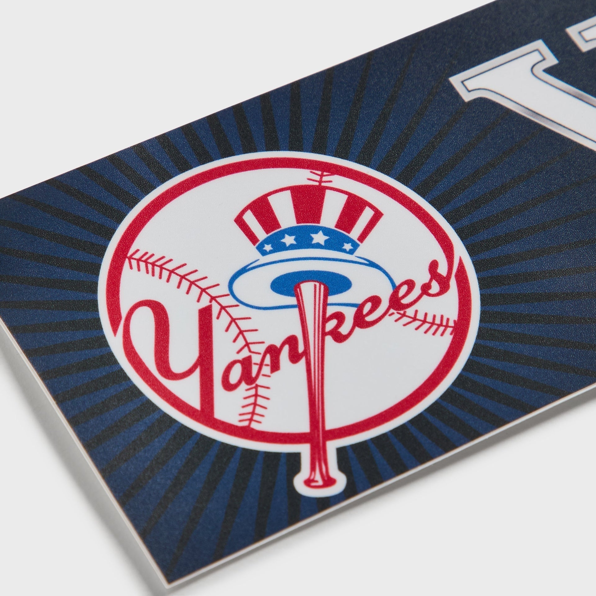 Close-up of the Yankees top hat emblem on the Kith x New York Yankees bumper sticker