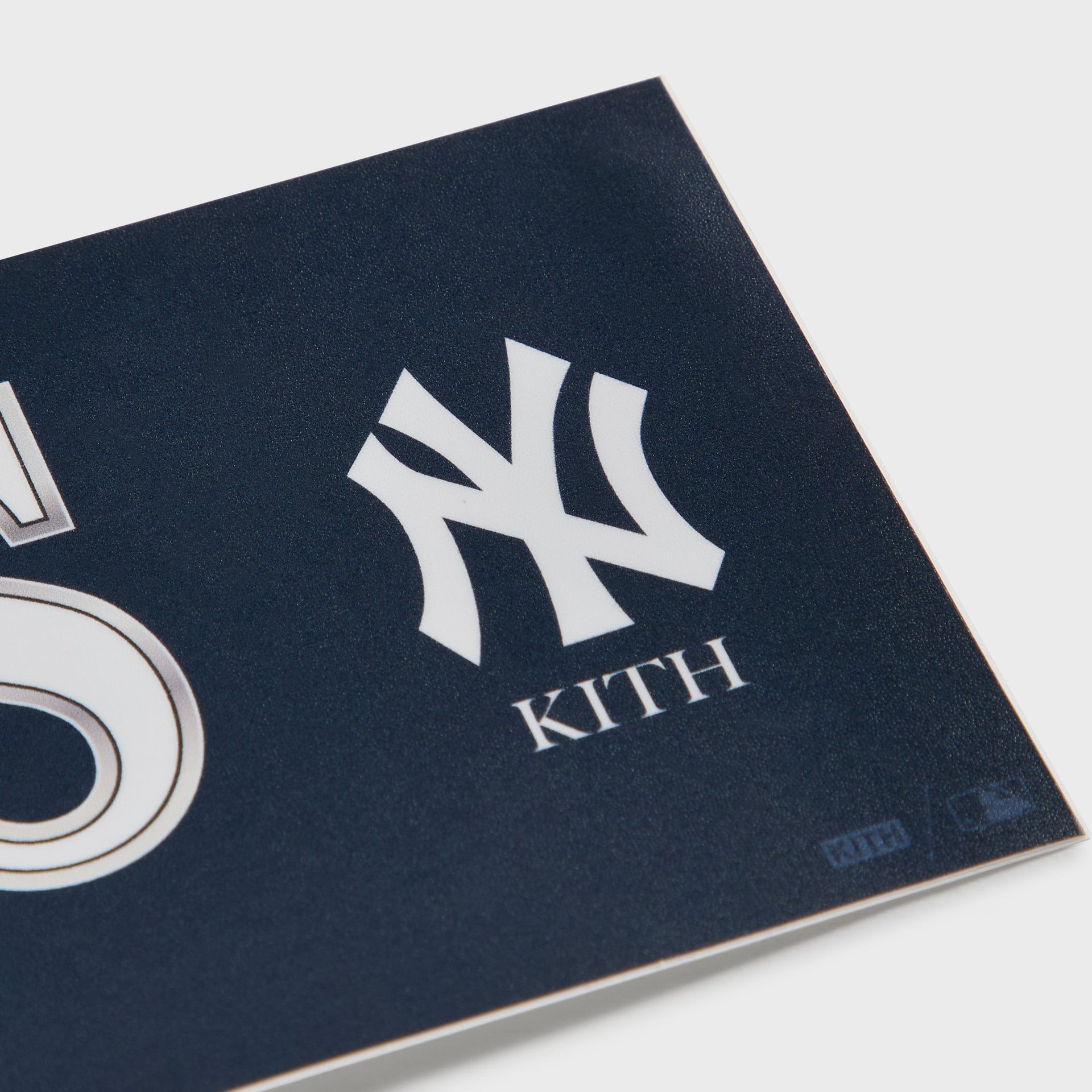 Close-up of the Kith and New York Yankees logo lockup on the right side of the bumper sticker