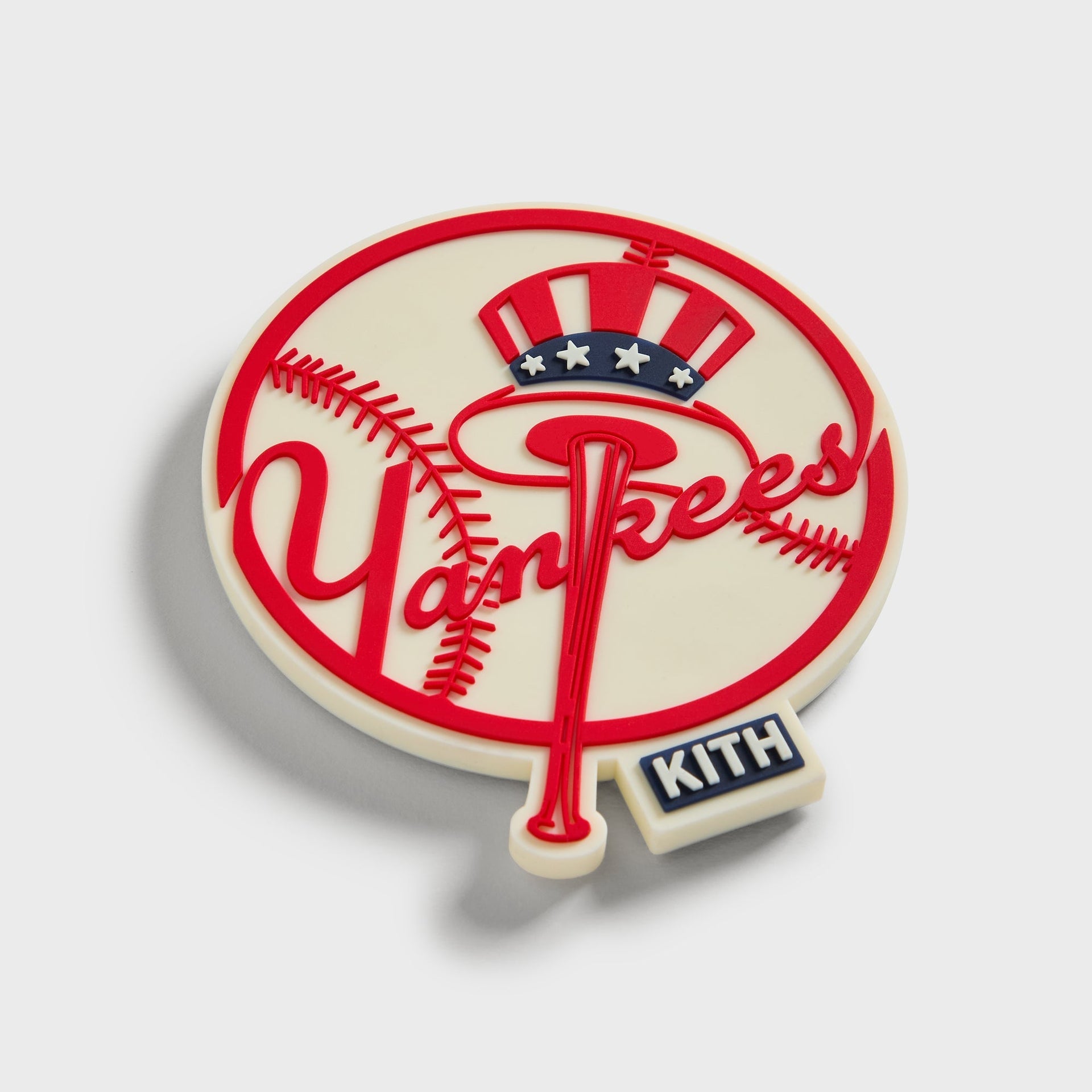 Angled view of the Kith x New York Yankees baseball logo fridge magnet