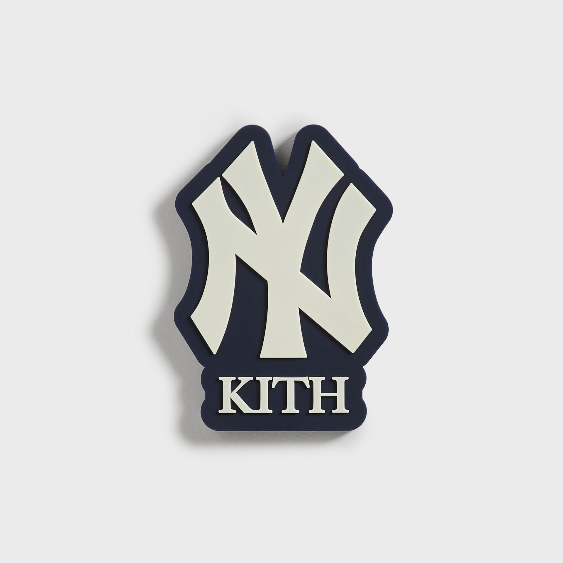 Kith for the New York Yankees fridge magnet in navy and cream, front view of the NY logo and Kith wordmark