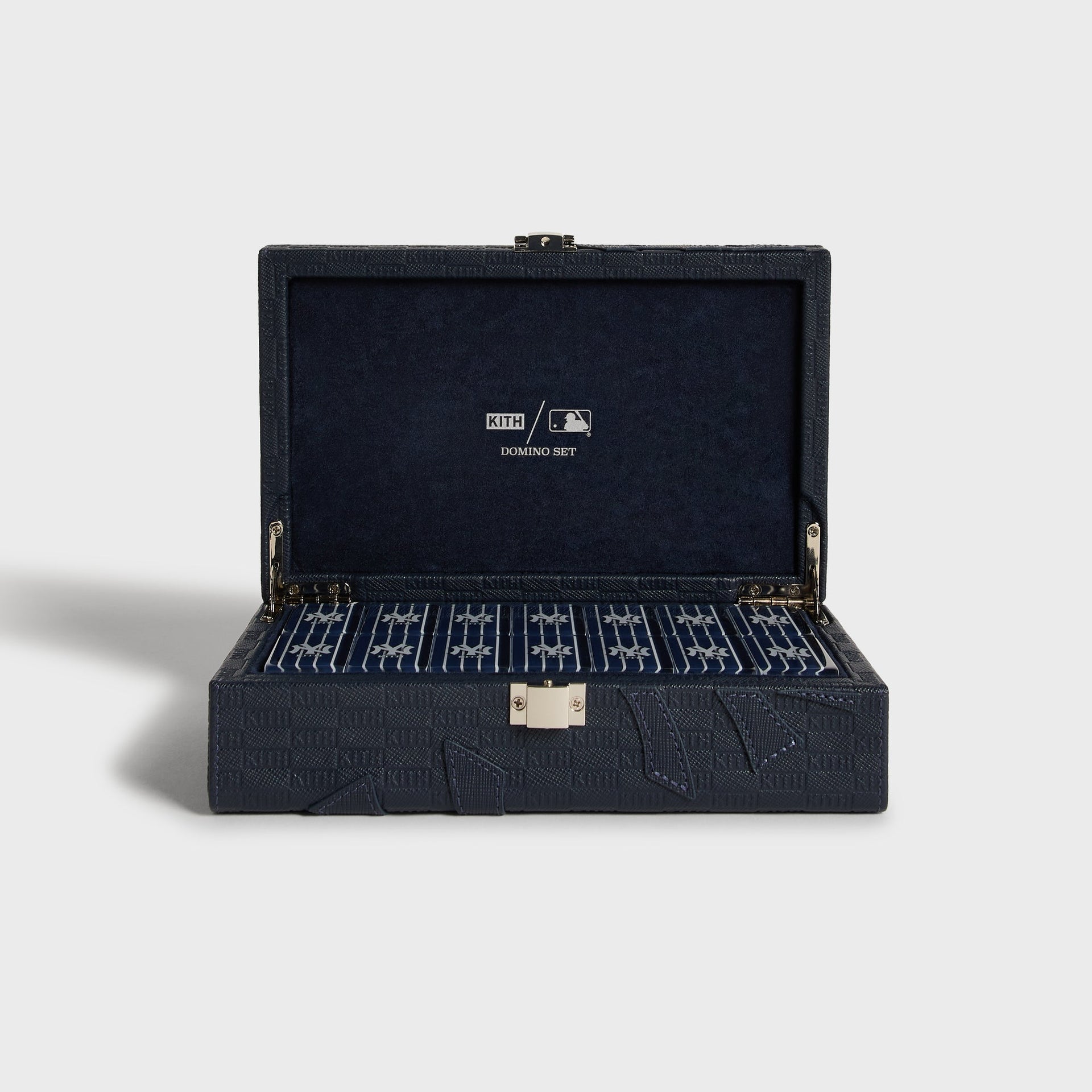 Kith for the New York Yankees leather domino set, open case front view showing the suede-lined lid