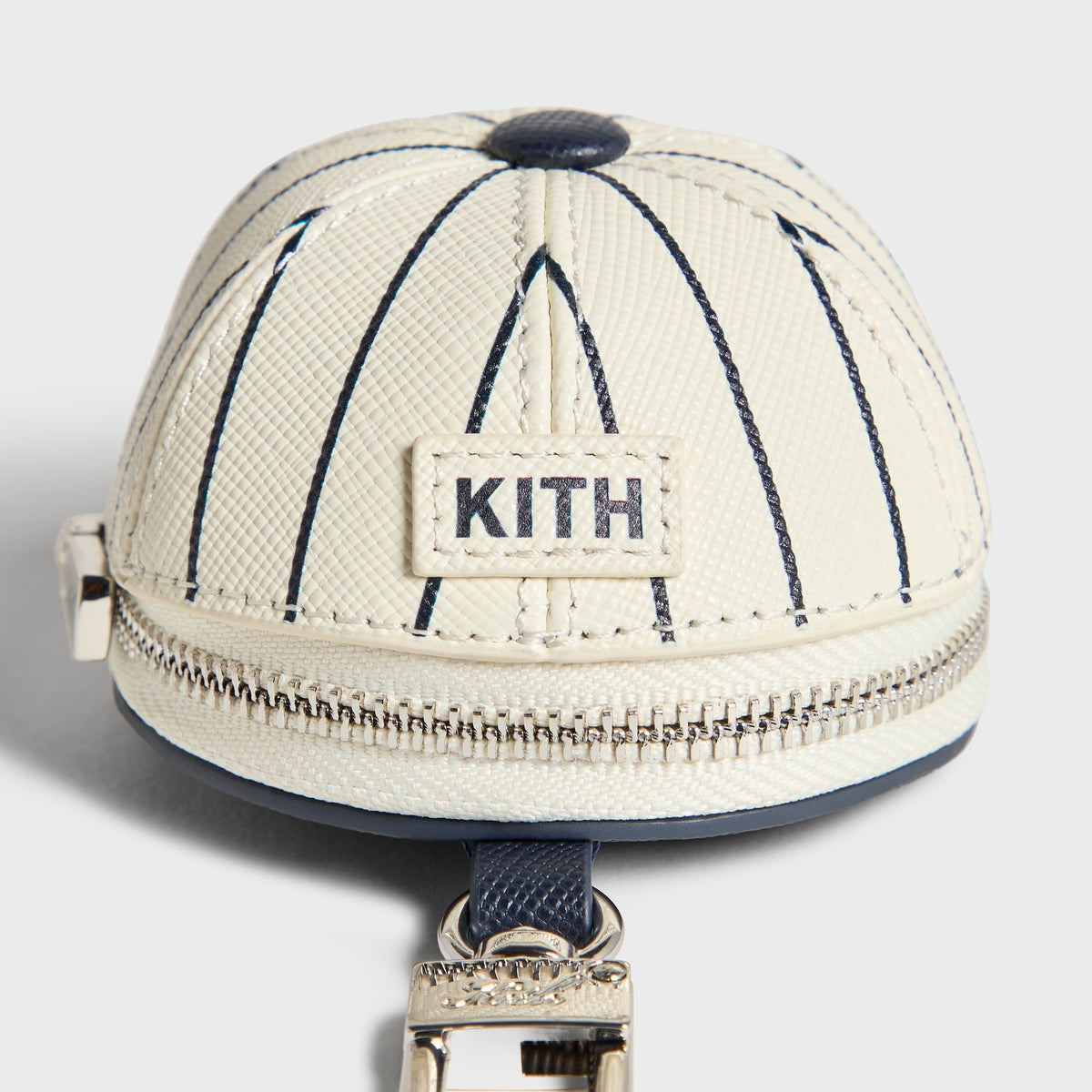 Kith x Yankees Baseball Cap Leather Pouch, Sandrift - top-down close-up of KITH logo patch and pinstripe stitching
