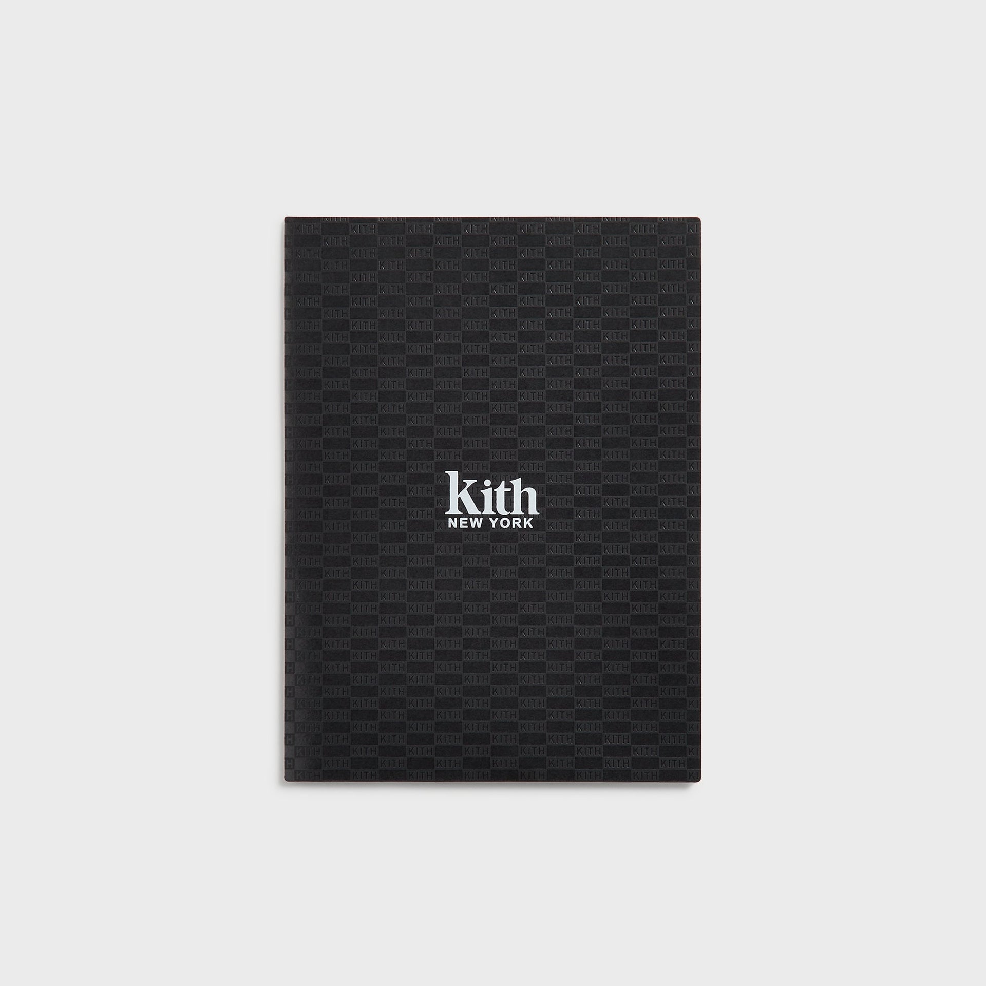 Black bound notebook from Kith Kids School Supplies Box Set with tonal KITH monogram print and white logo