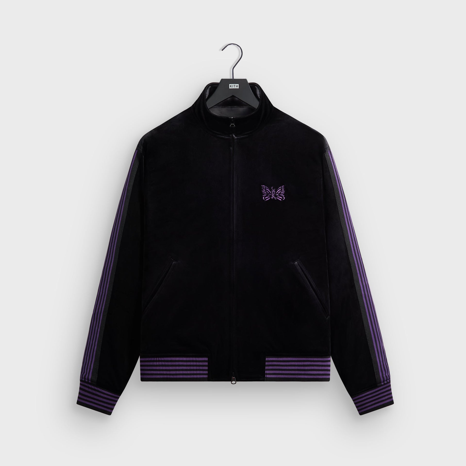 Kith for Needles Rui track jacket in black velour with purple striped ribbing, front flat lay