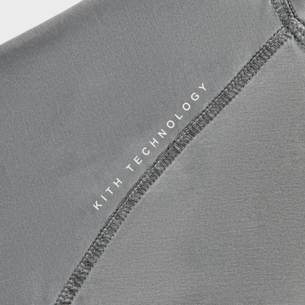 Close-up of Kith Garment-Dyed Paneled Donovan Tee chest logo, KTECH Kith wing emblem