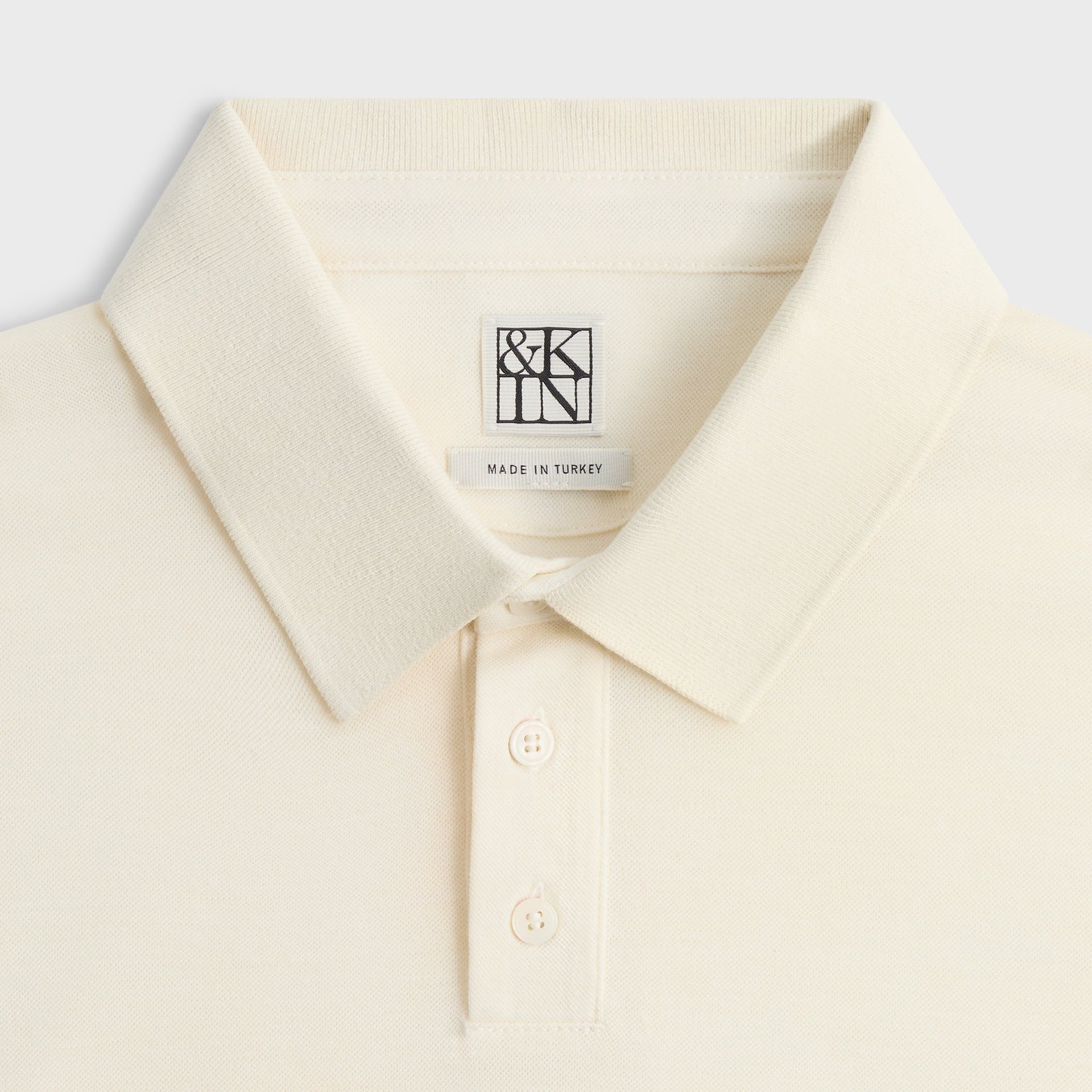 &Kin Melton Polo detail: ribbed collar, &Kin woven label and two-button placket, cream