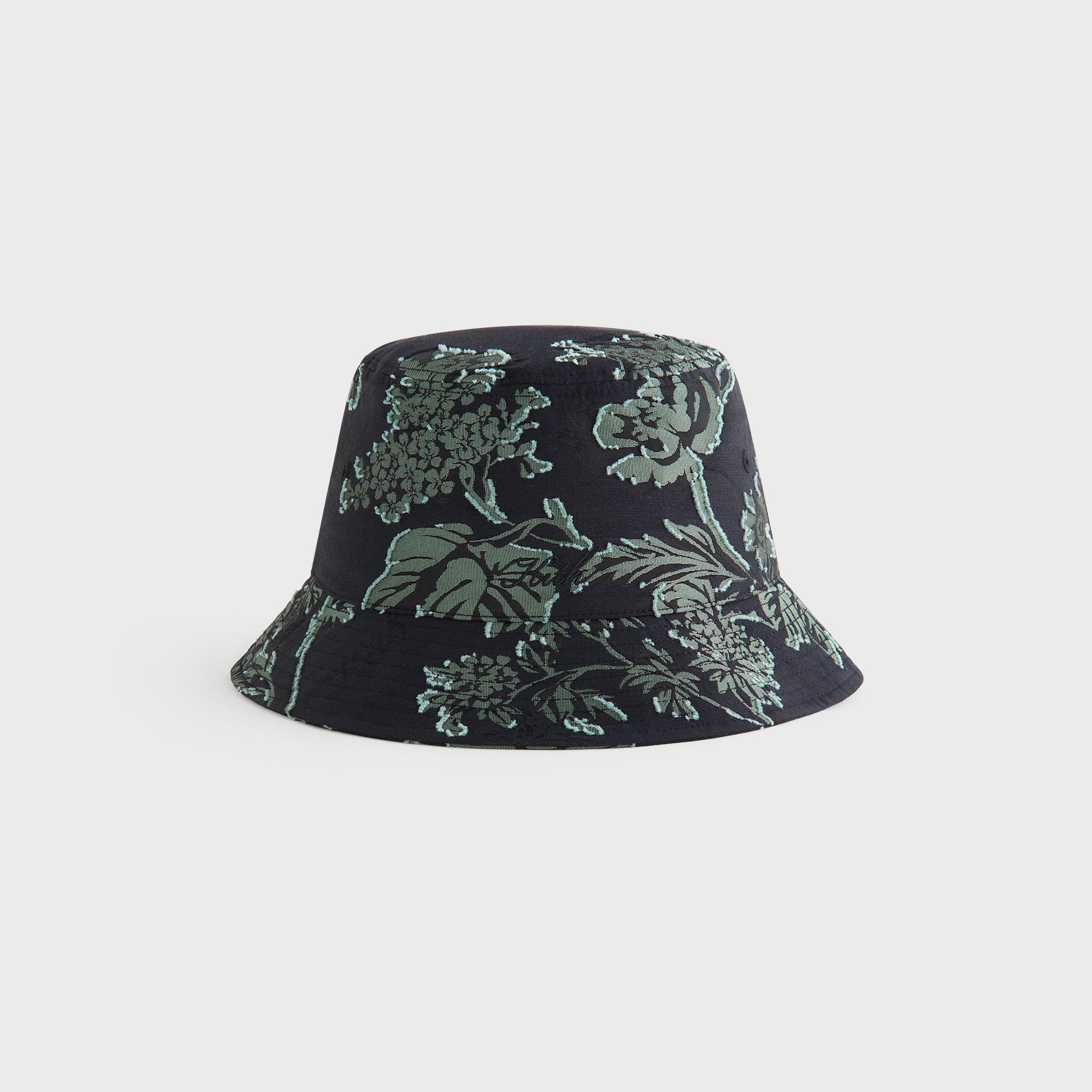 Kith for Needles Dawson bucket hat in black clip jacquard with sage green floral pattern, 3/4 view flat lay