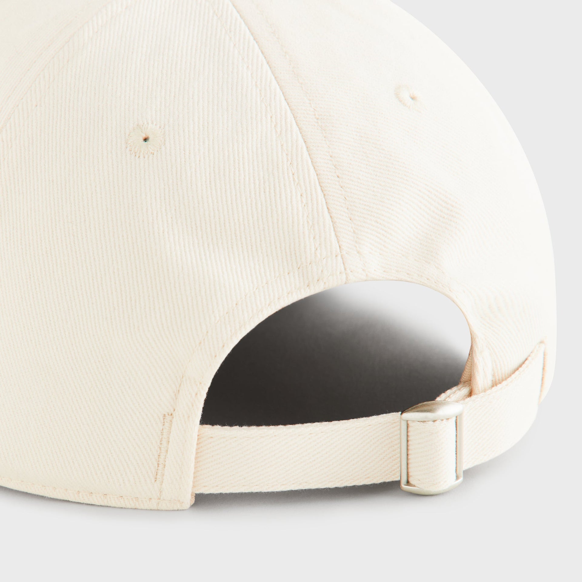Kith Script Brushed Twill Bay Low Pinch Crown Cap in Nocturnal, close-up of back strap adjuster buckle