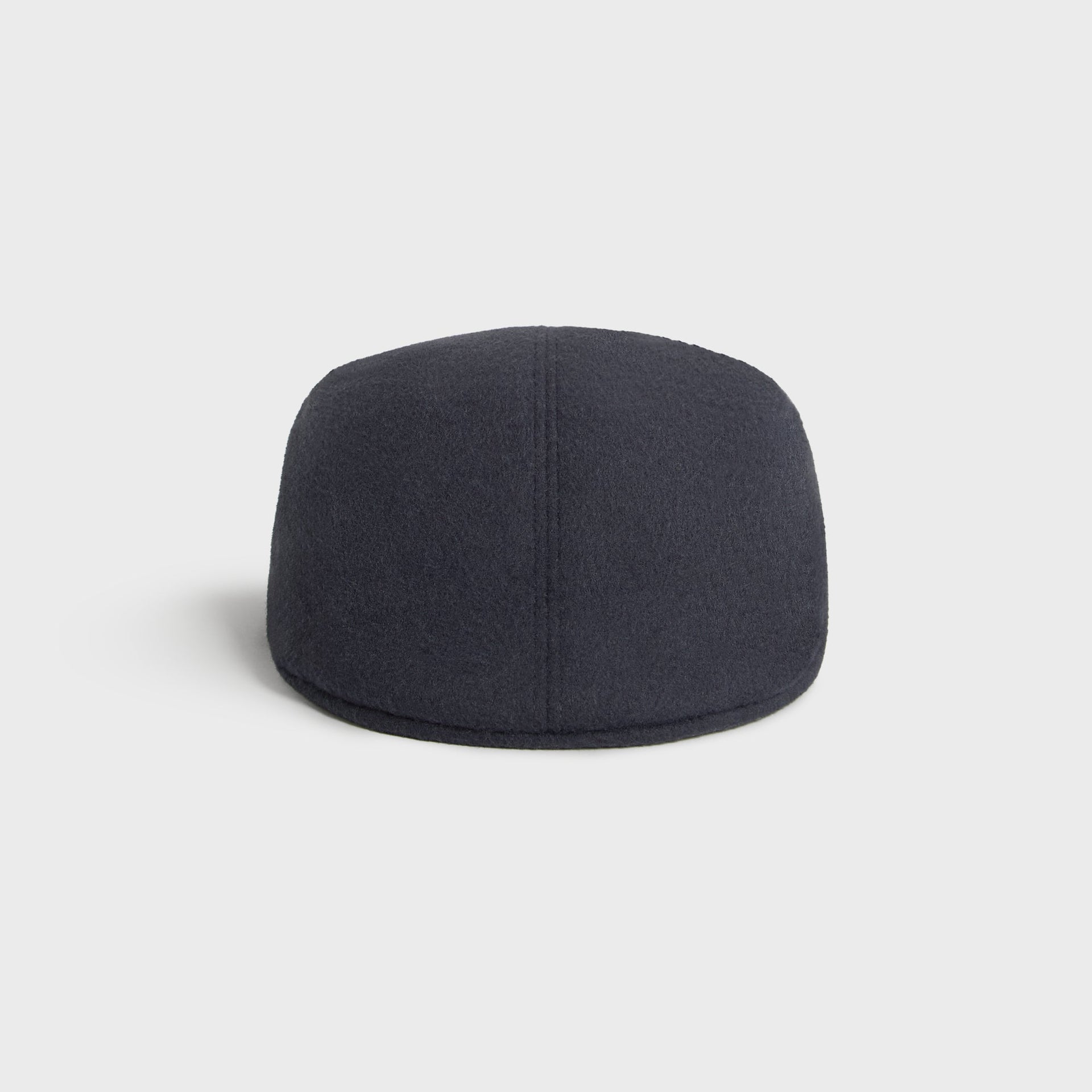 Kith Script Double-Face Wool Drivers Cap in Nocturnal charcoal, back view showing the gored wool panel construction.