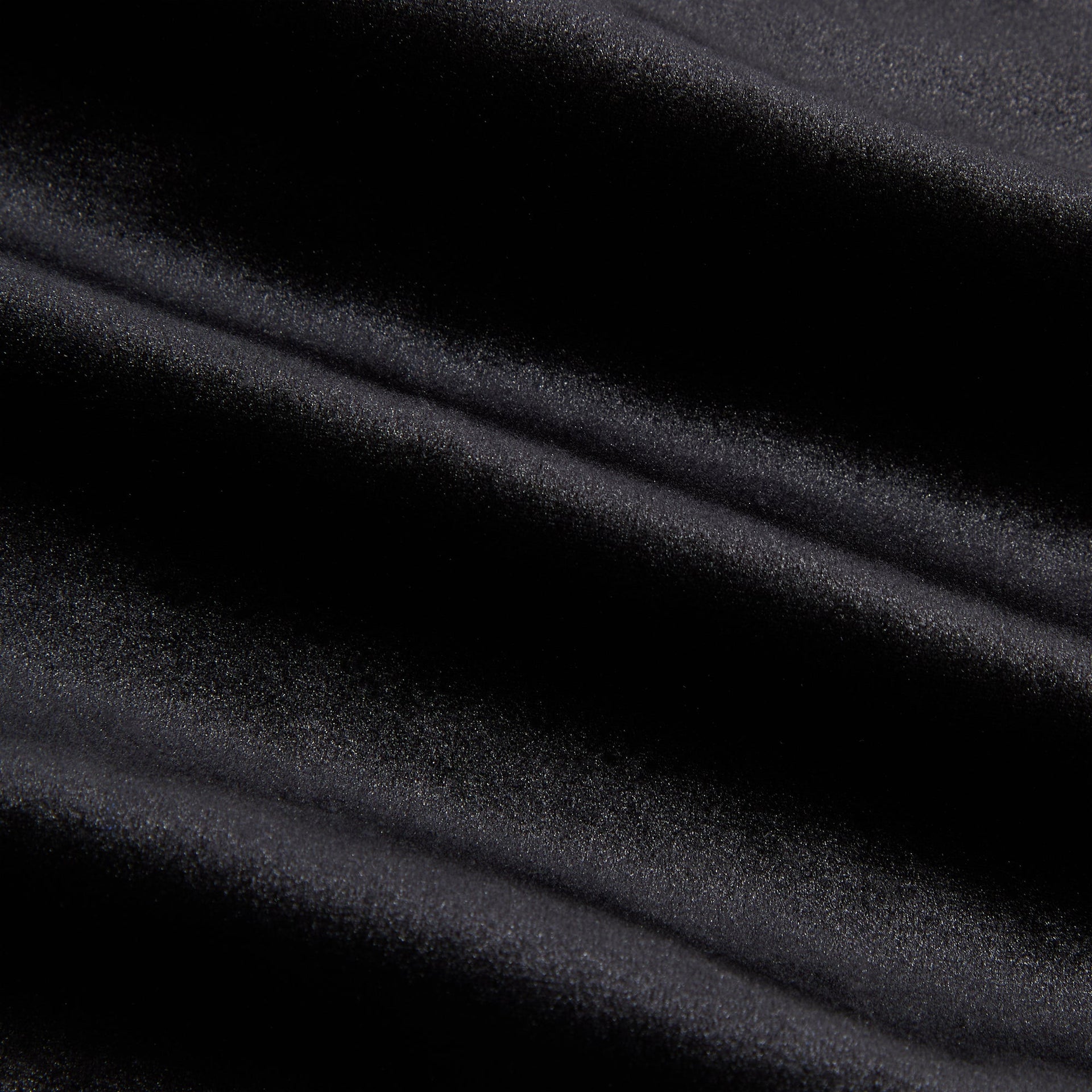 Close-up of the black velour fabric texture on the Kith for Needles Ronan fringe pant