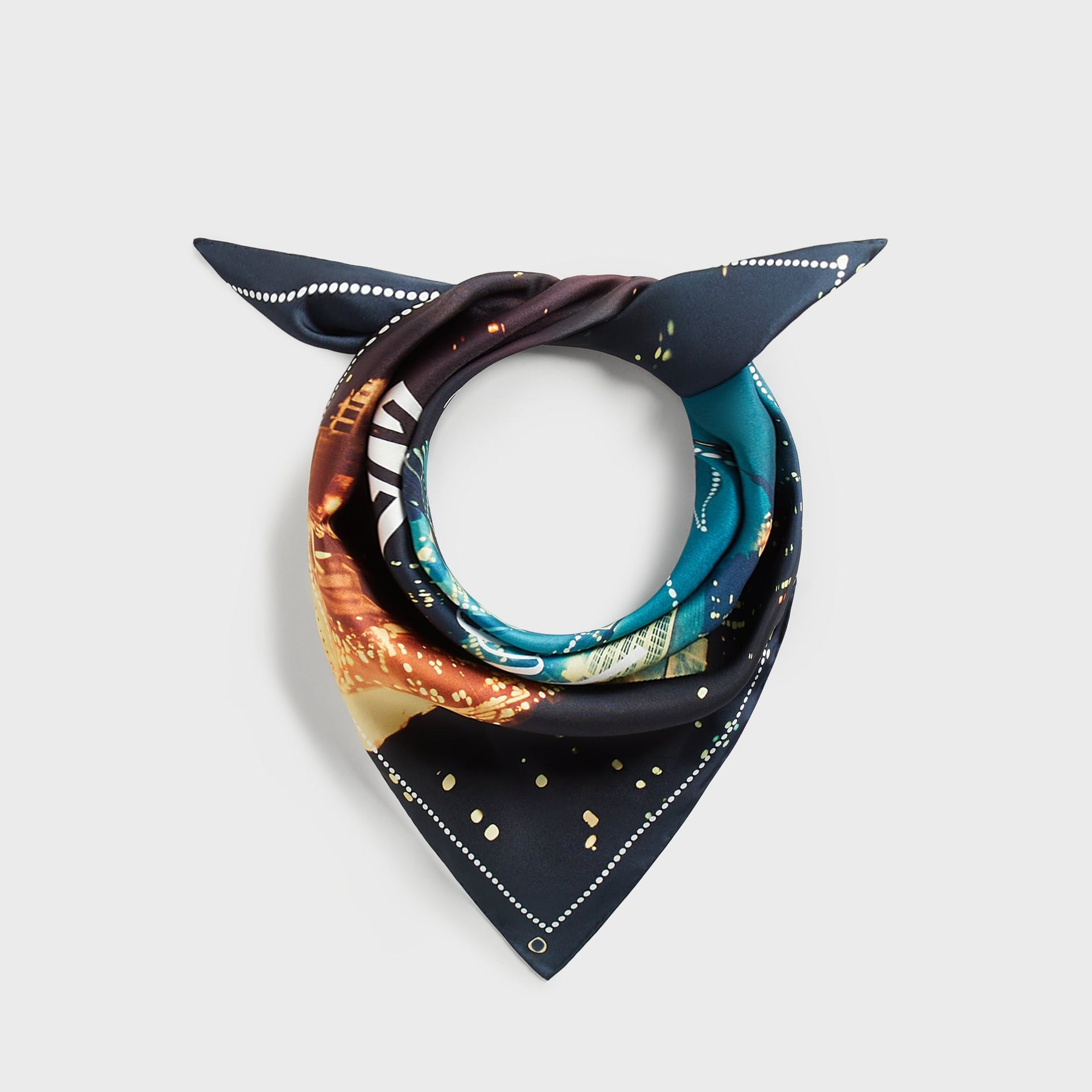 Kith Silk Bandana in Multi tied in a knot, showing NYC skyline print in teal, navy and gold tones