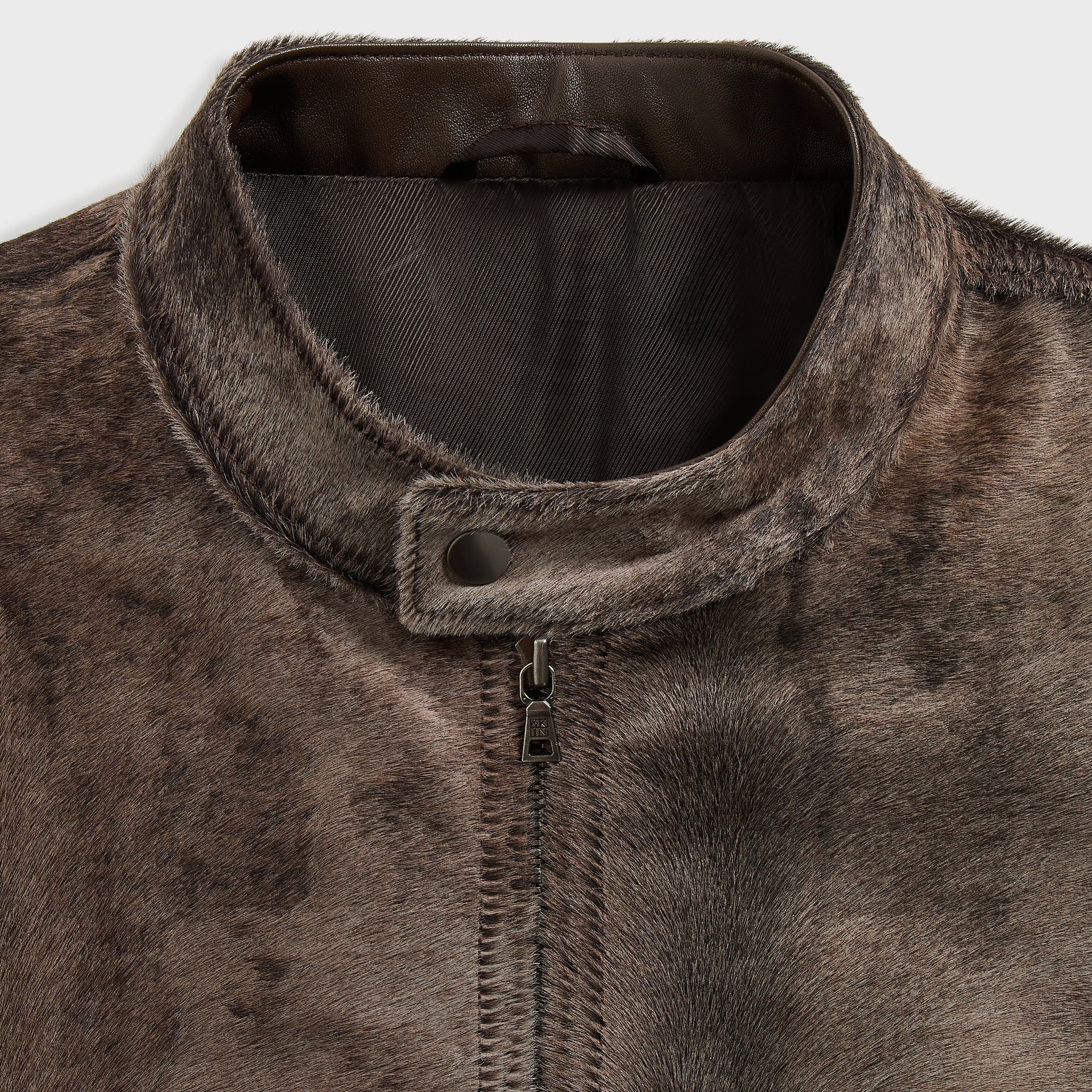 &Kin Cassius Moto Jacket detail: snap-tab band collar with leather trim and &Kin zip pull, brown pony hair