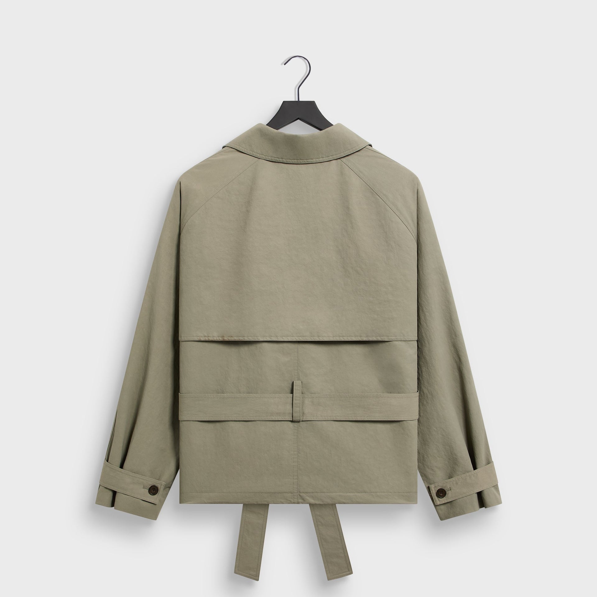 &Kin Nikolai Cropped Trench in Scene sage, back view on hanger with cape yoke and back belt strap