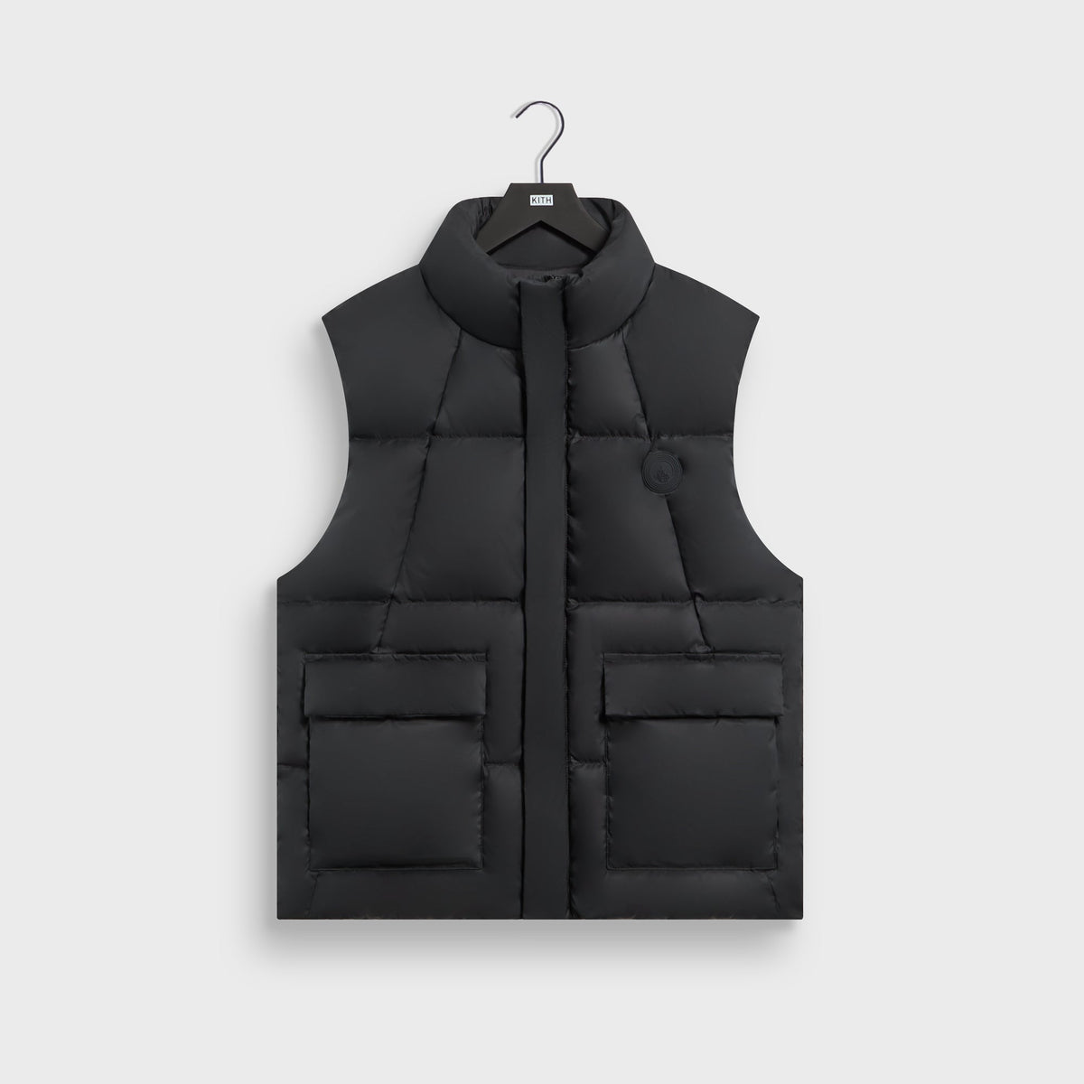 Kith Matte Stretch Taffeta Midi Puffer Vest in black, front view, with stand collar and flap pockets