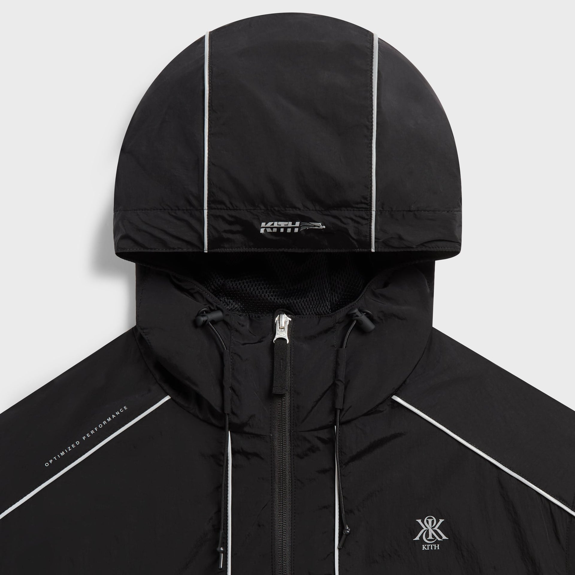 Close-up of the hood and zip closure on the Kith Nylon Bolt shell jacket in black