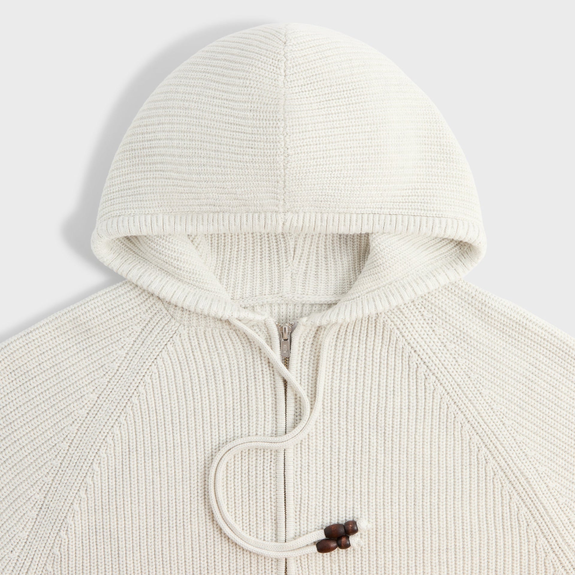 Close-up of the hood and wood toggle drawstring on the Kith Full Zip Knit Miles hoodie