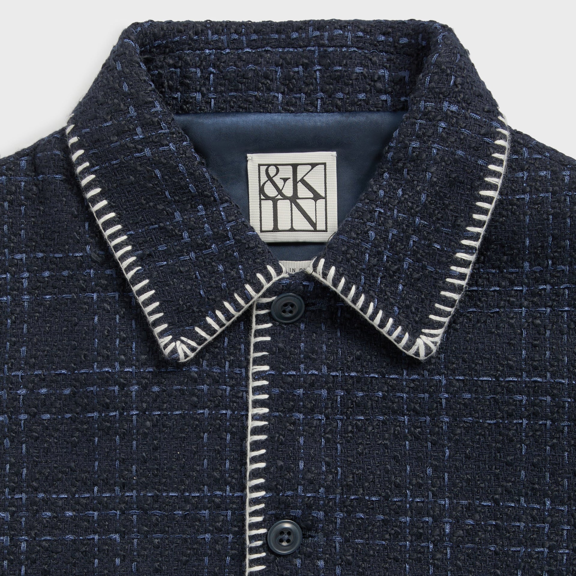 &Kin Tweed Boxy Collared Overshirt collar detail, &Kin woven label and white whipstitch button placket