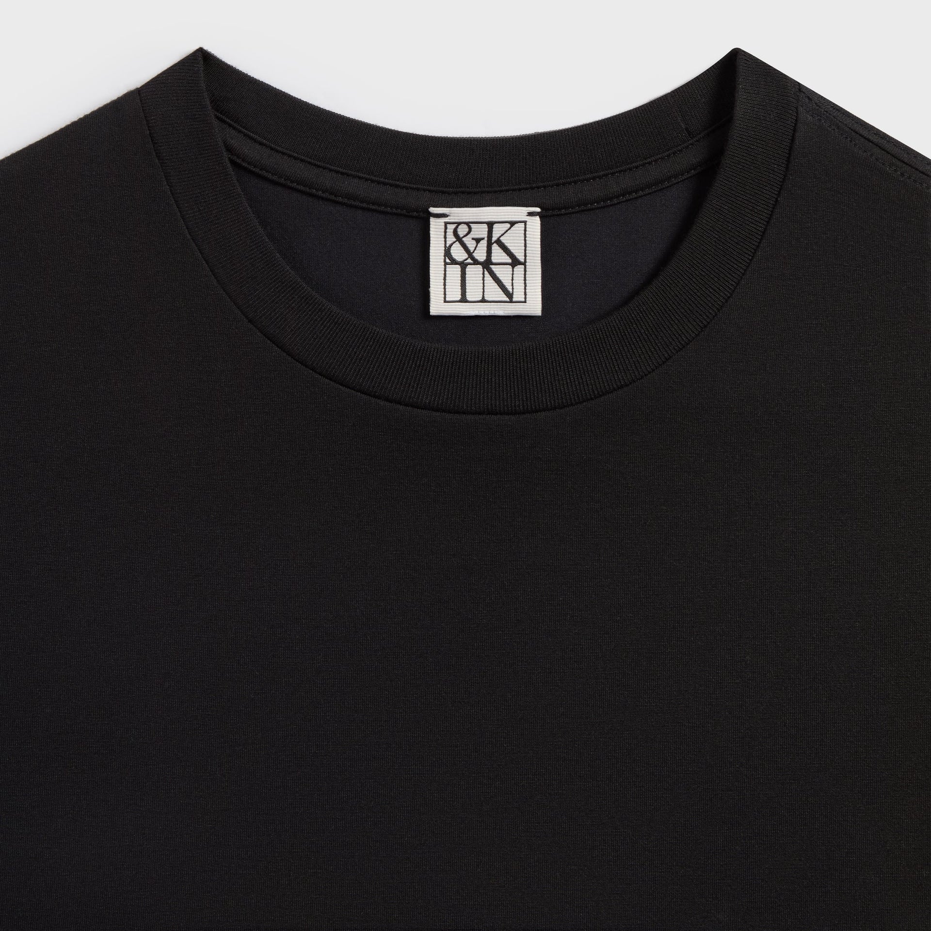 &Kin Long Sleeve Halston Tee neckline close-up with the woven &Kin box label