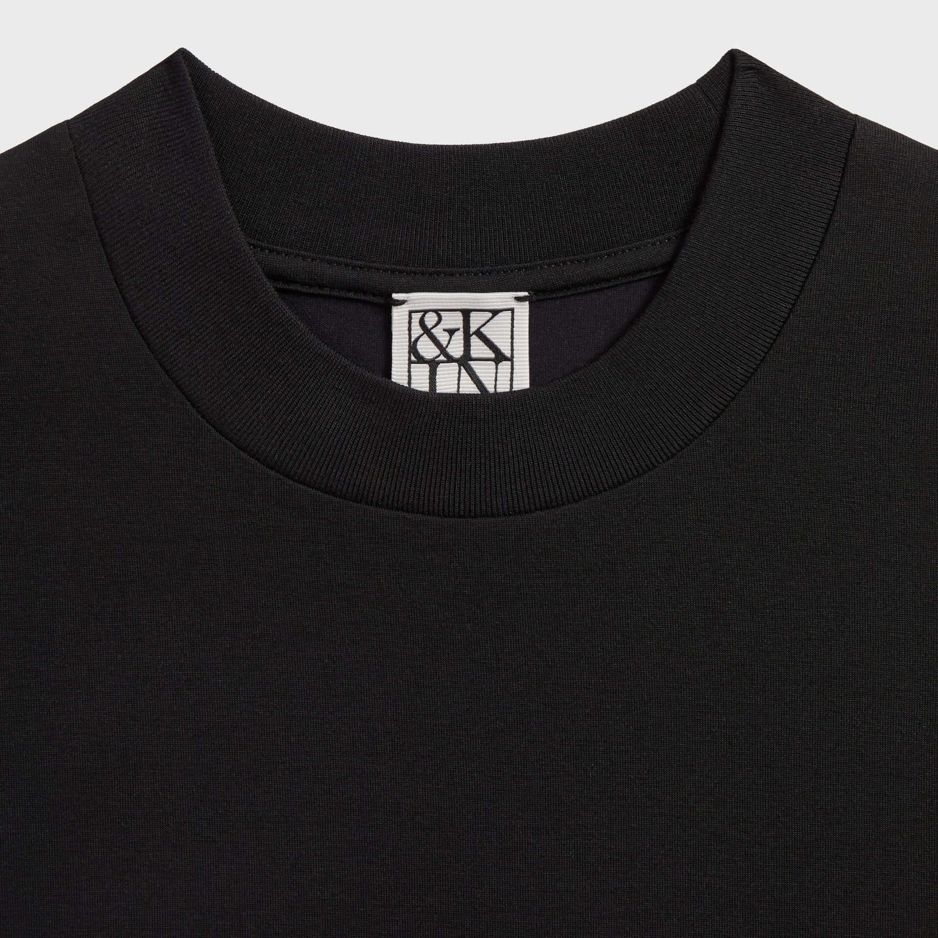 &Kin Mock Neck Albie Tee neckline close-up with the woven &Kin box label
