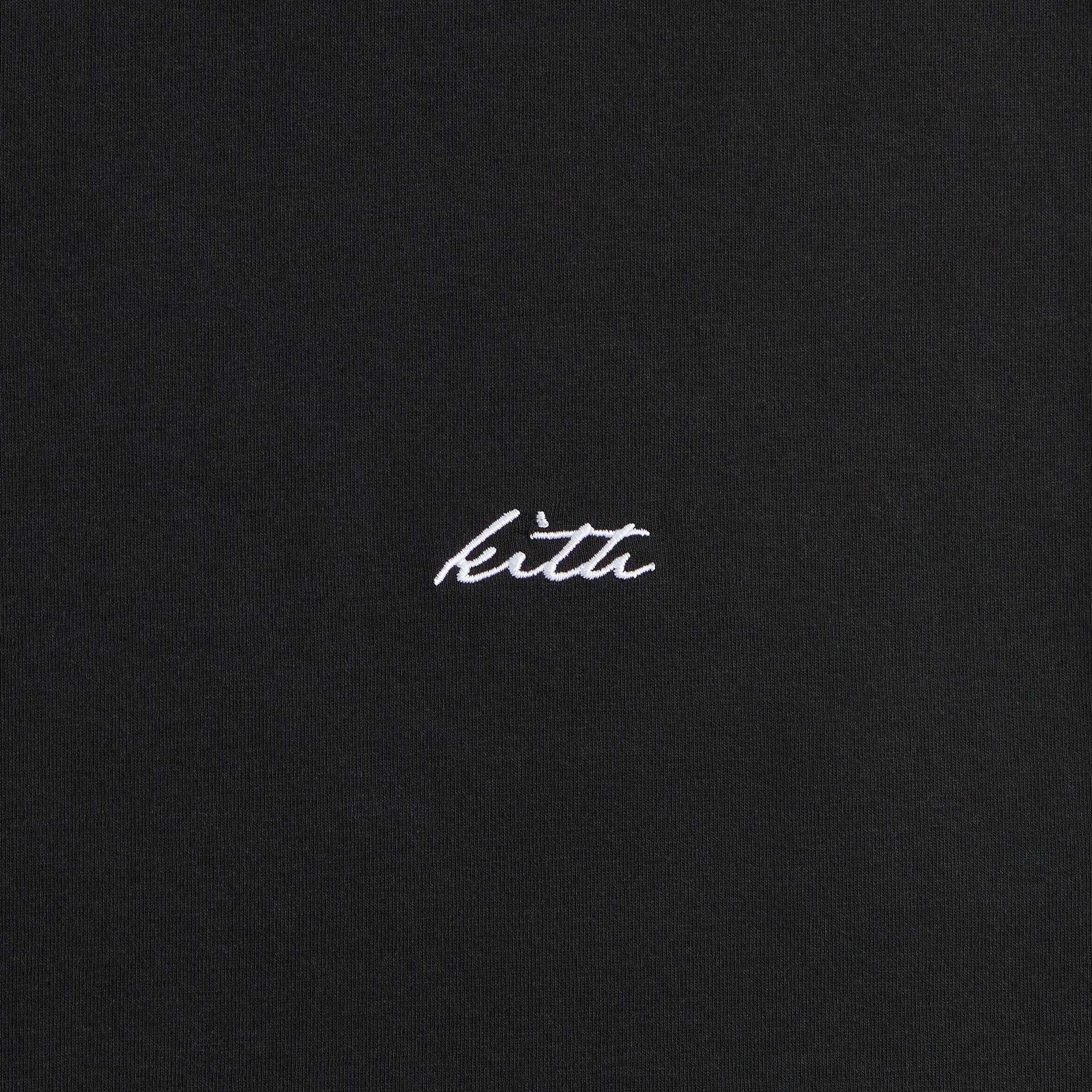 Close-up of the embroidered Kith script logo on the Albie crewneck tee in black