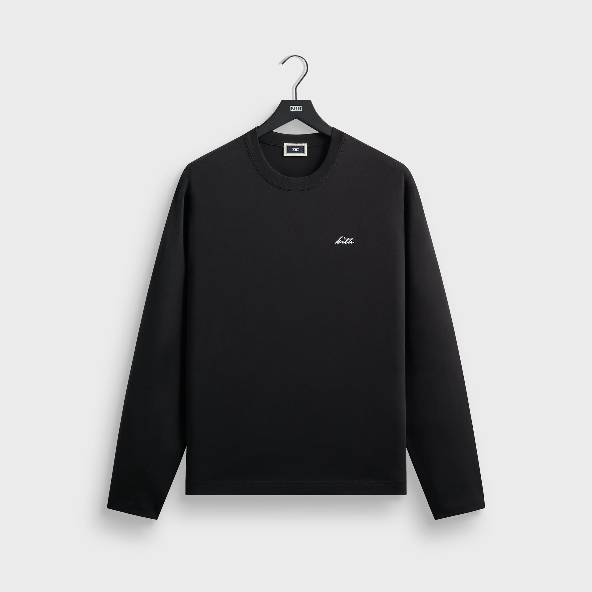 Kith Long Sleeve Alex boxy tee in black cotton, front flat lay on hanger