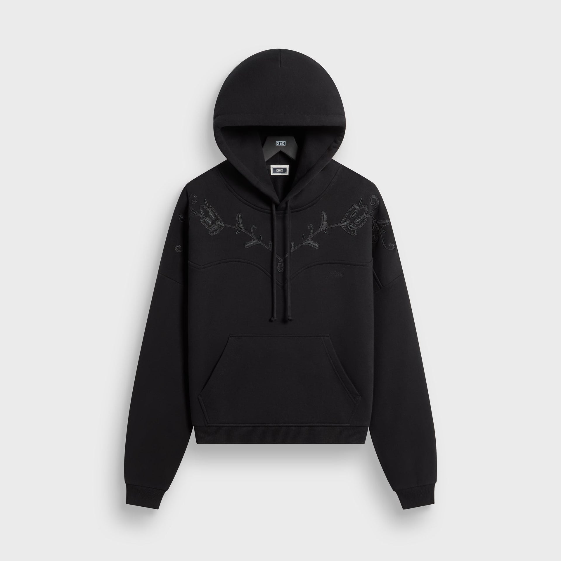 Kith Heritage Filigree Braxton hoodie in black with tonal floral filigree yoke embroidery, front flat lay