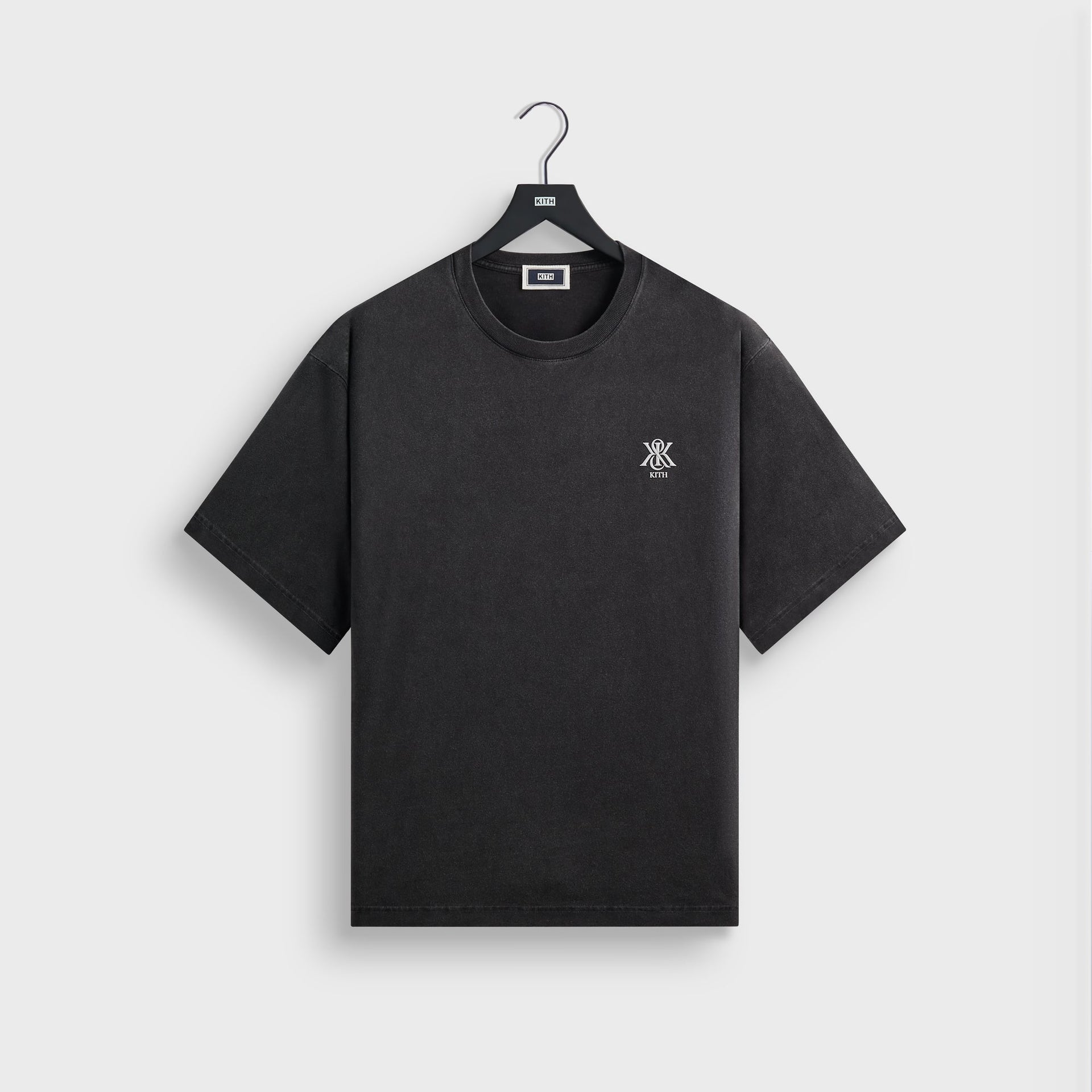 Kith Guardian Alex boxy vintage tee in faded black with small chest logo, front flat lay