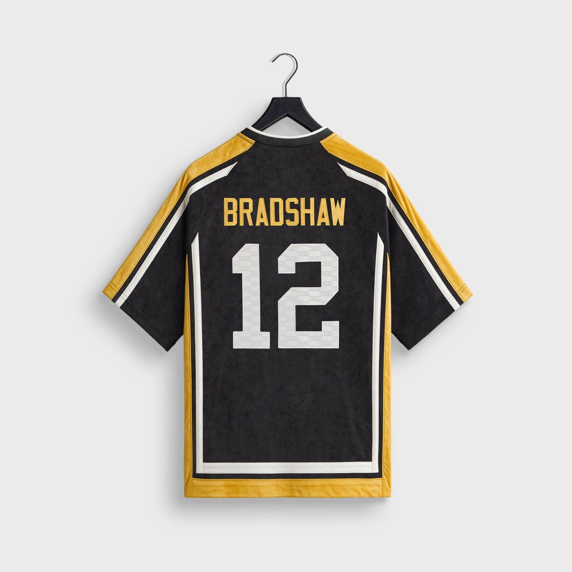 Kith and the NFL for the Pittsburgh Steelers Leon shirt, back flat lay showing Bradshaw 12 nameplate