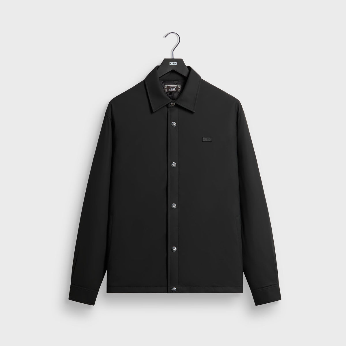 Kith Stretch Poly Brixton Shirt Jacket in black, front view, snap-front shirt jacket