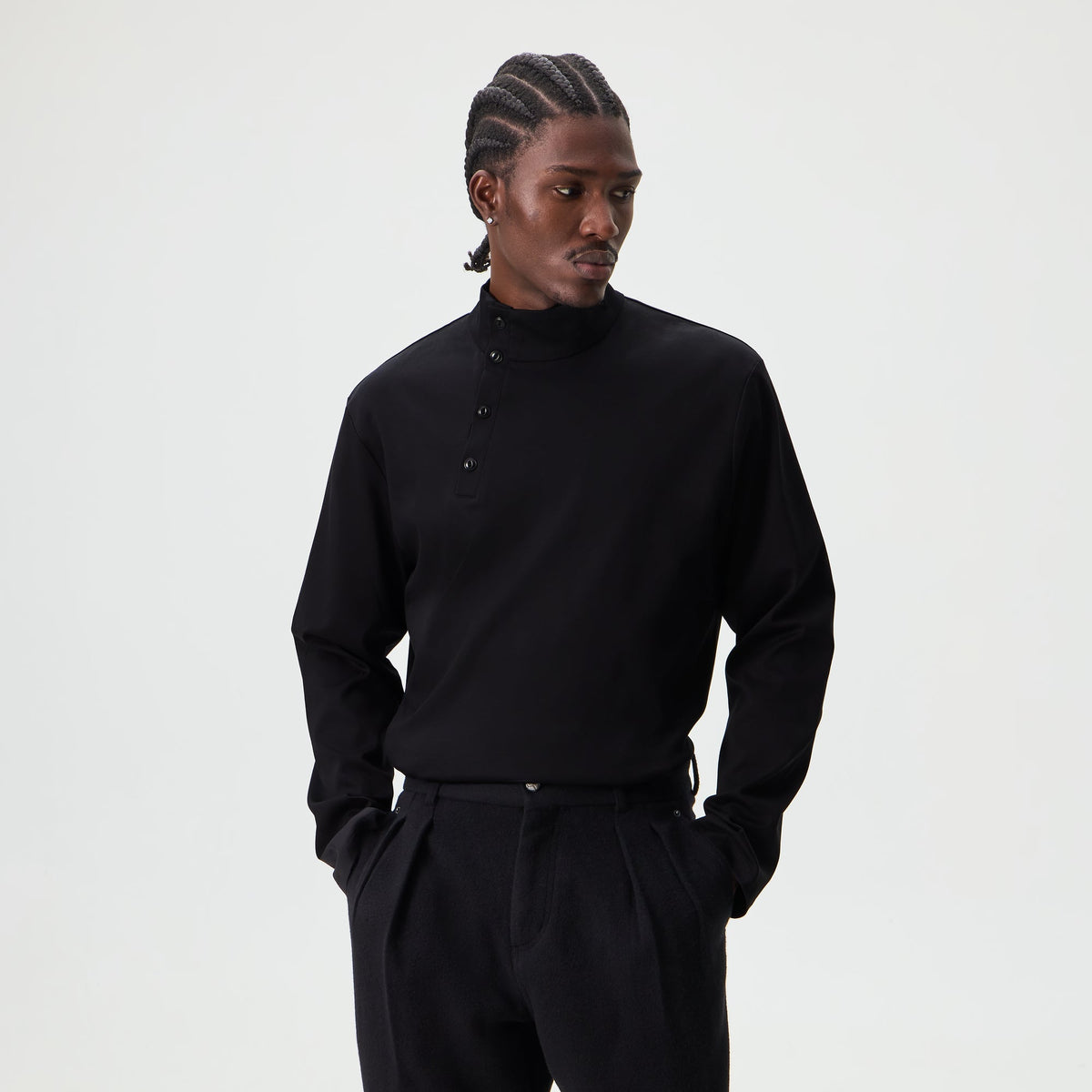 Man wearing black &Kin Interlock Cyrus mock-neck top, front view