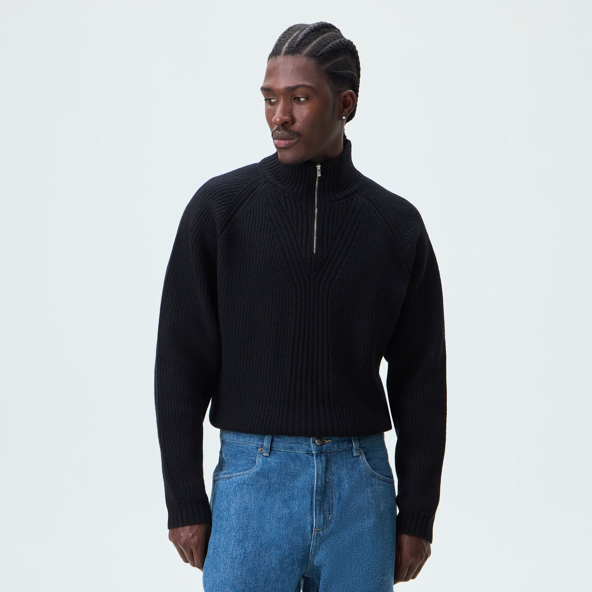Man wearing black Kith Marled Copeland quarter-zip knit pullover, front view