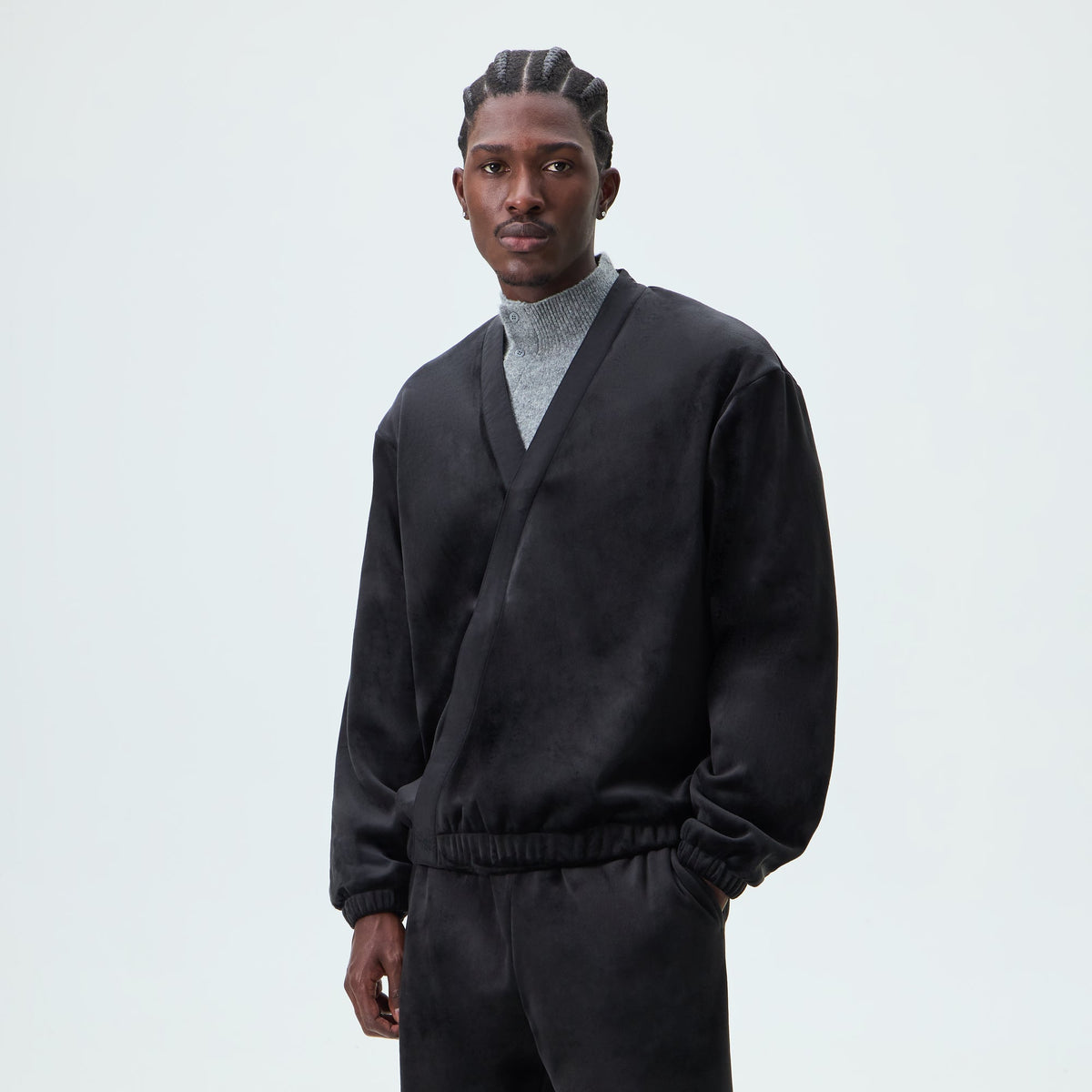 Man wearing black Kith Plush Double Fleece Strauss shawl cardigan, front view
