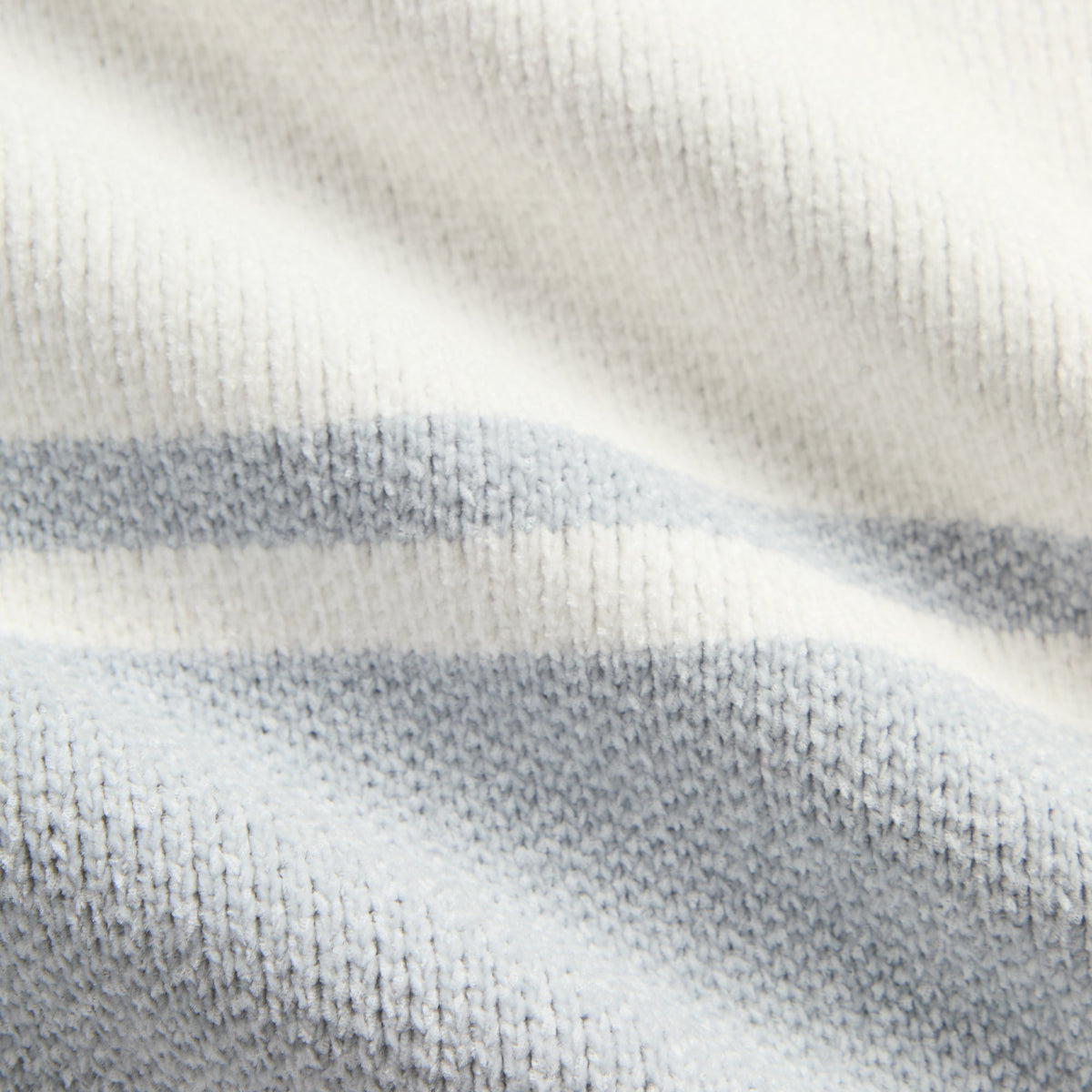 Close-up of the light heather grey and cream knit fabric of the Kith Nelson rugby sweater