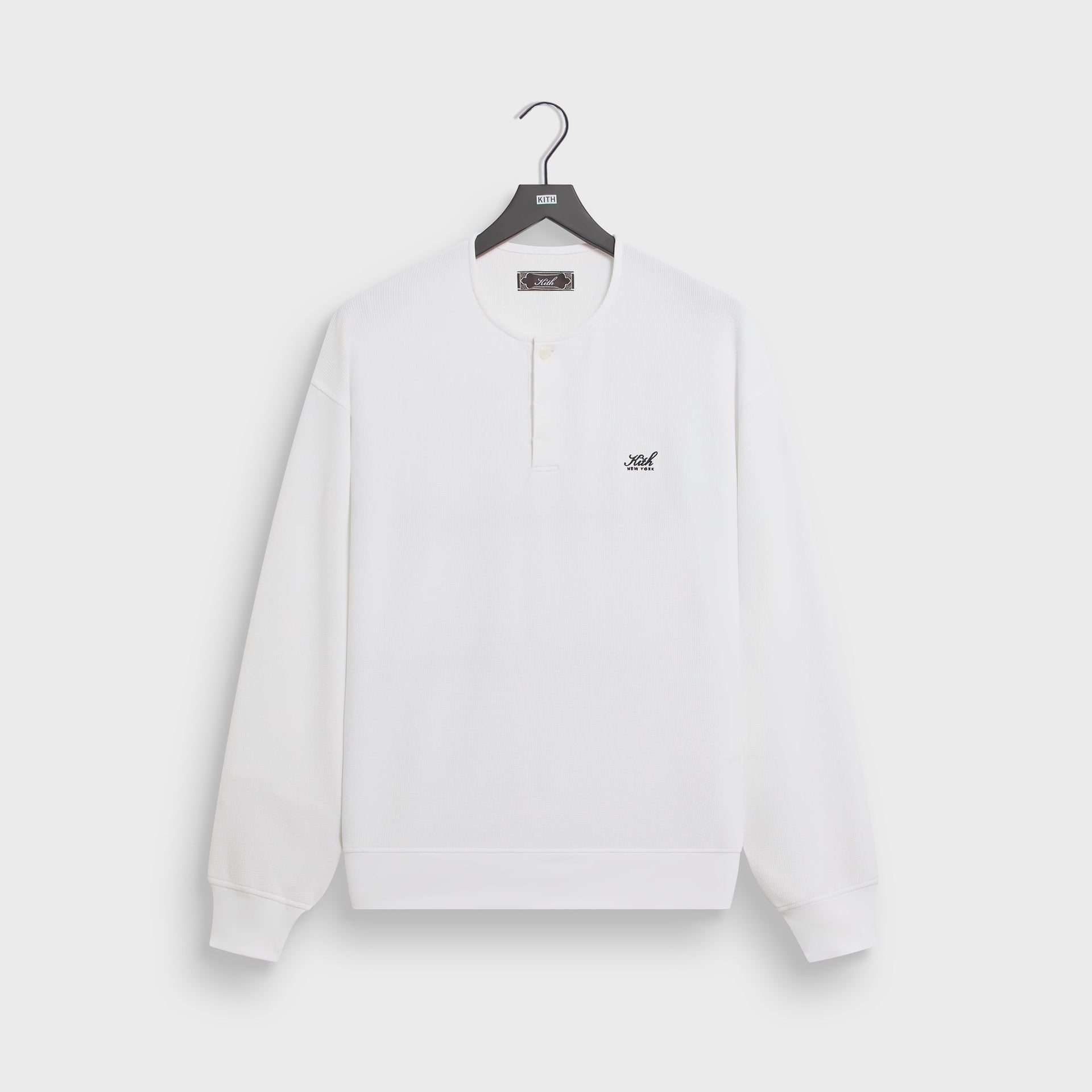 Kith Micro Waffle Long Sleeve Colby pullover in white with henley placket, front flat lay