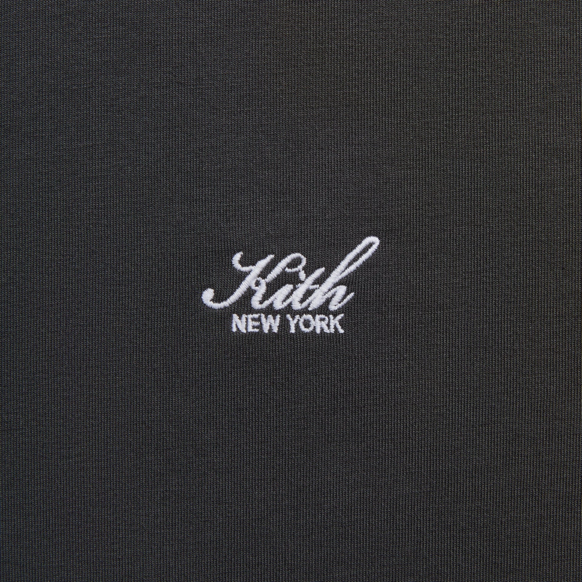 Close-up of the embroidered Kith New York script logo on the LAX tee in black