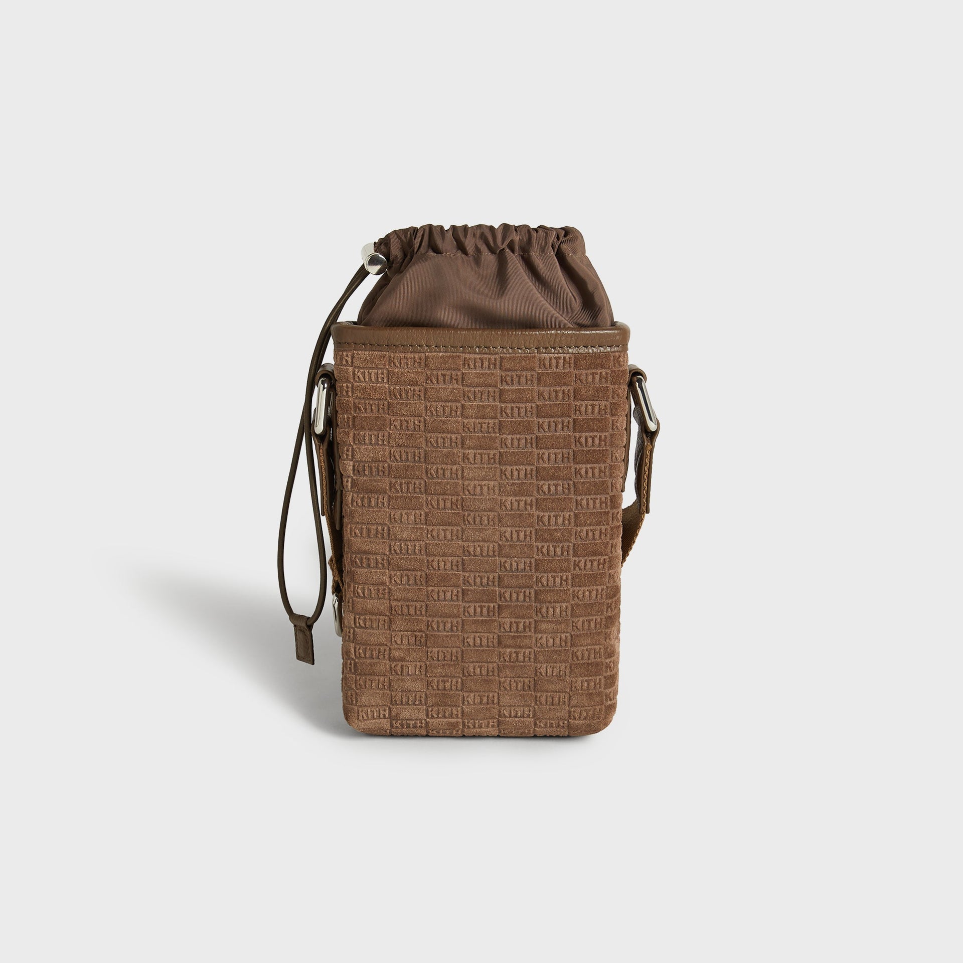 Back view of the Kith Monogram Suede Drawstring Pouch in Java showing embossed KITH suede pattern
