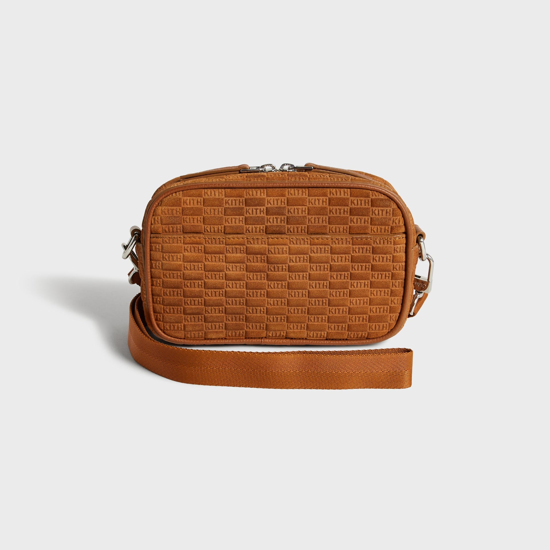 Kith Monogram Suede Crosswalk K20 Bag in Argil tan, front view with embossed KITH pattern and coiled crossbody strap
