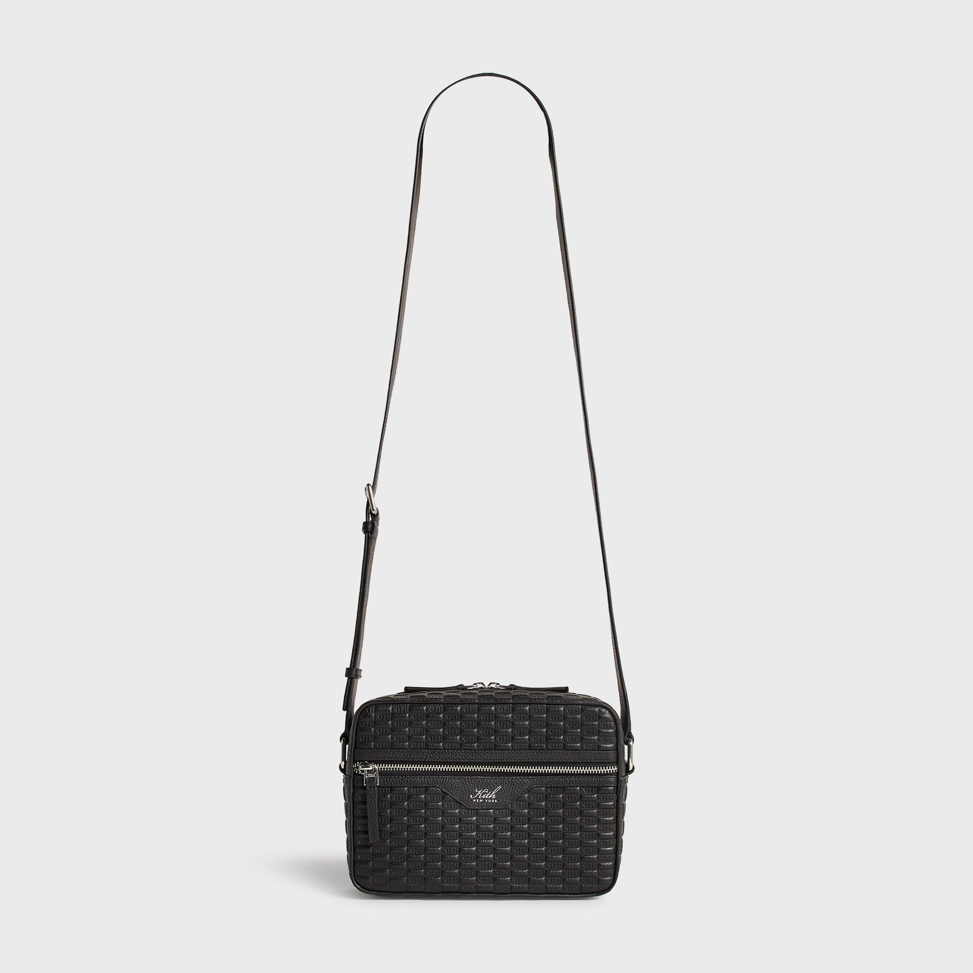 Kith Monogram Tumbled Leather Camera Crossbody Bag in Black, full view with long crossbody strap extended