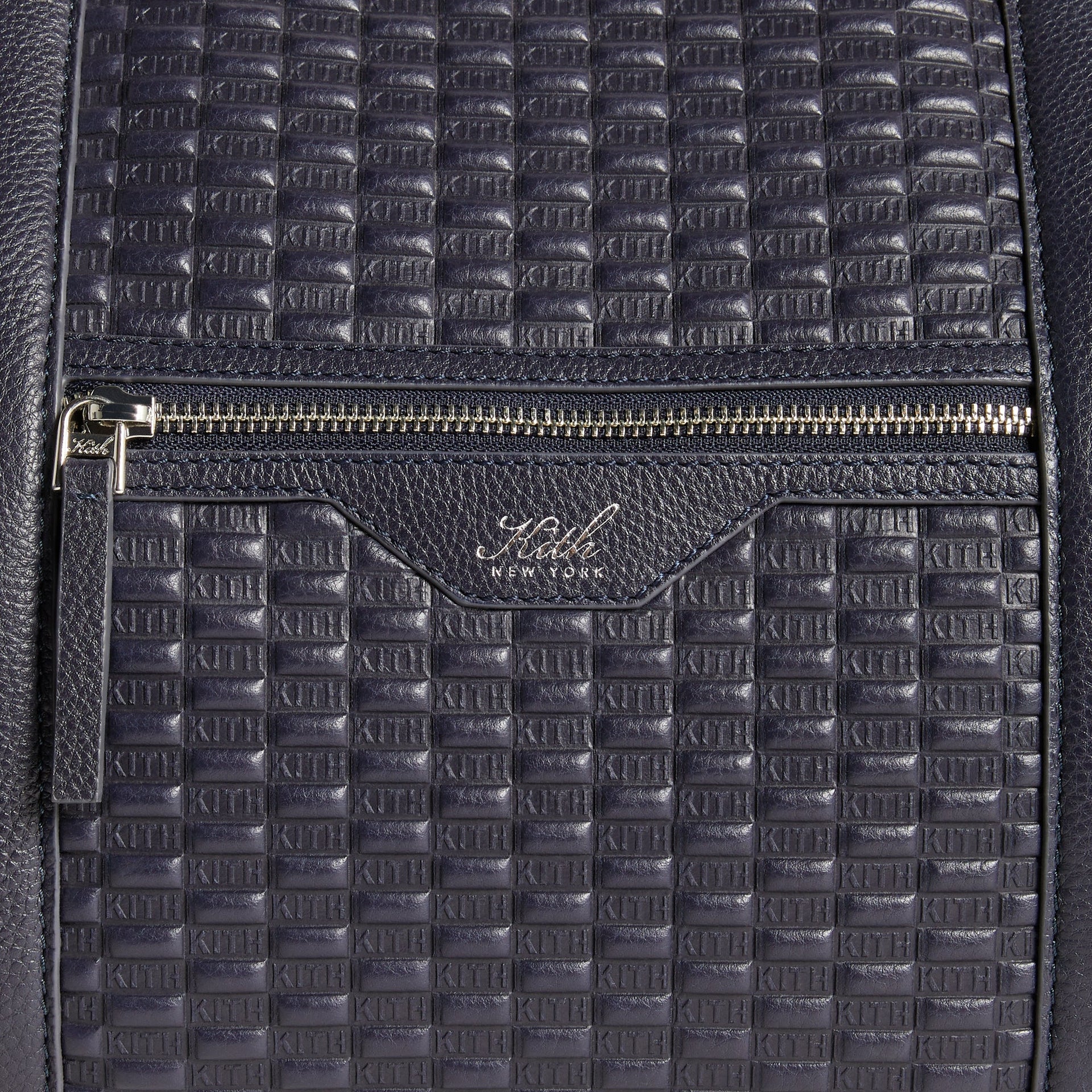 Close-up detail of front zip pocket with Kith New York wordmark on Monogram Traveler Duffle Bag in Ink