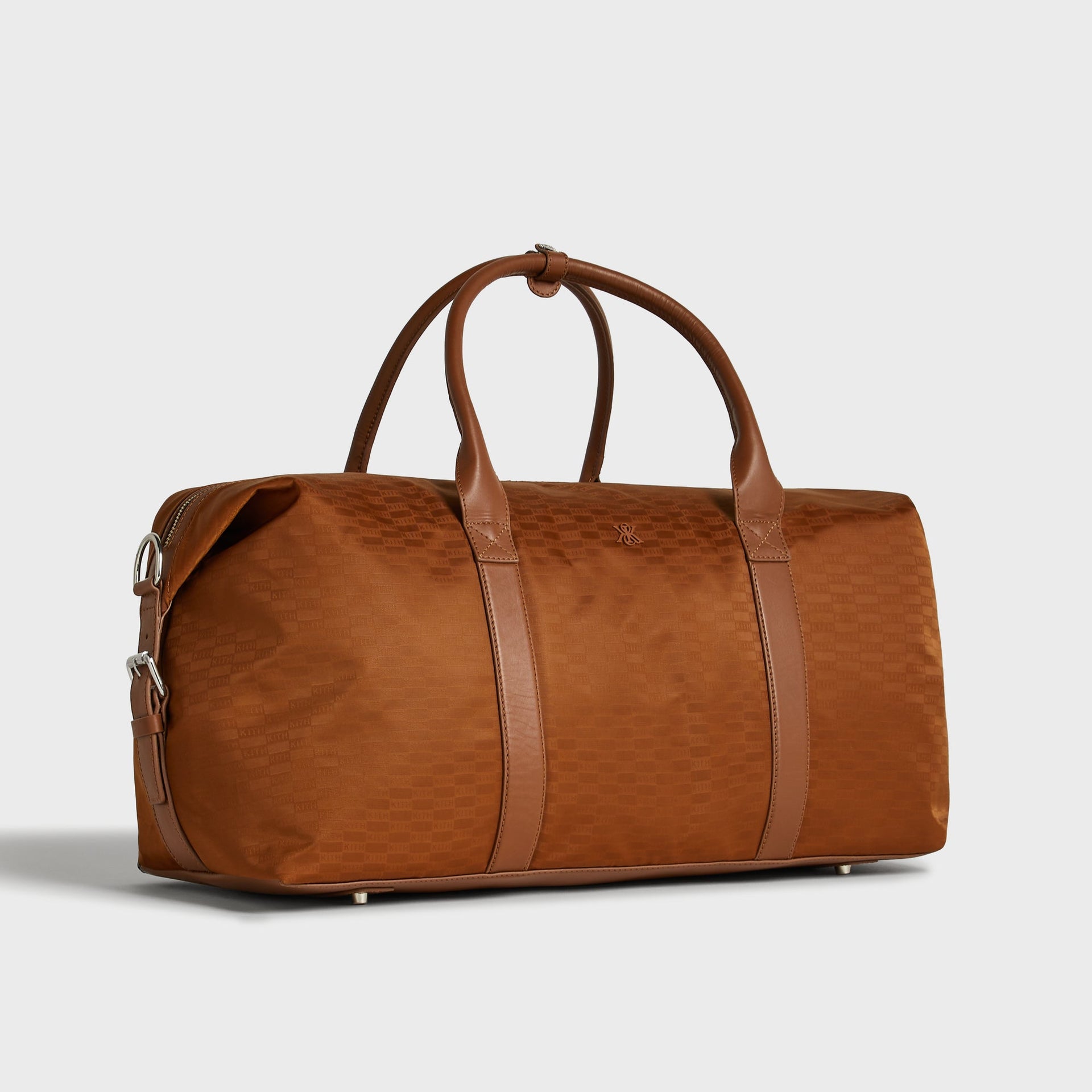 Kith Monogram Nylon Leather Duffle Bag in Tectonic, three-quarter angle showing removable shoulder strap