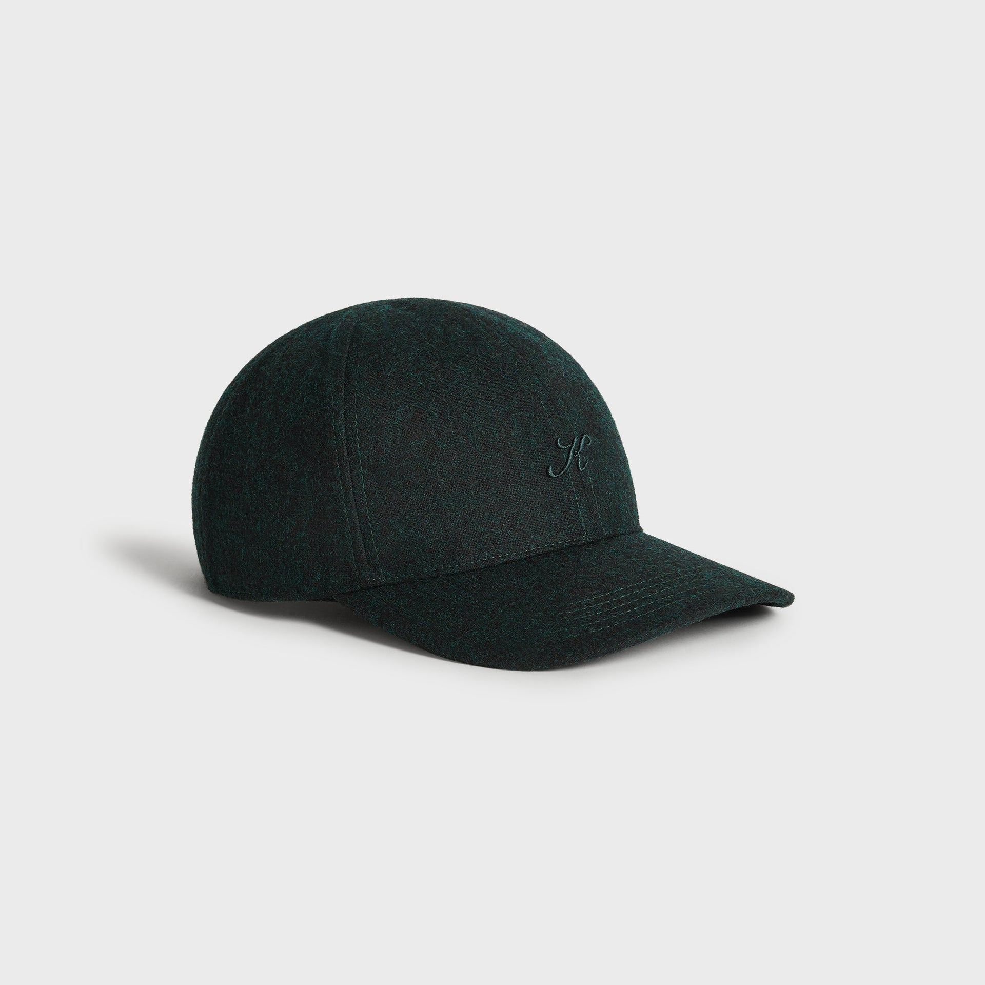 Kith Low Profile Fine Wool Classic Cap in Stadium, three-quarter side angle showing the low-profile crown and curved brim