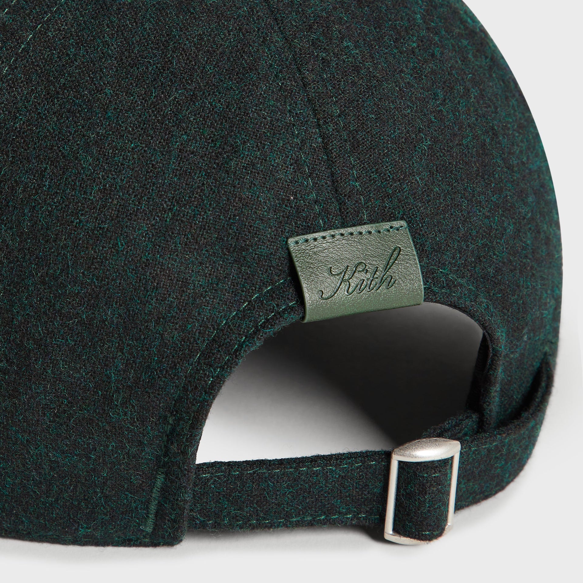 Kith Low Profile Fine Wool Classic Cap in Stadium, close-up of the back strap adjuster and Kith leather patch tag