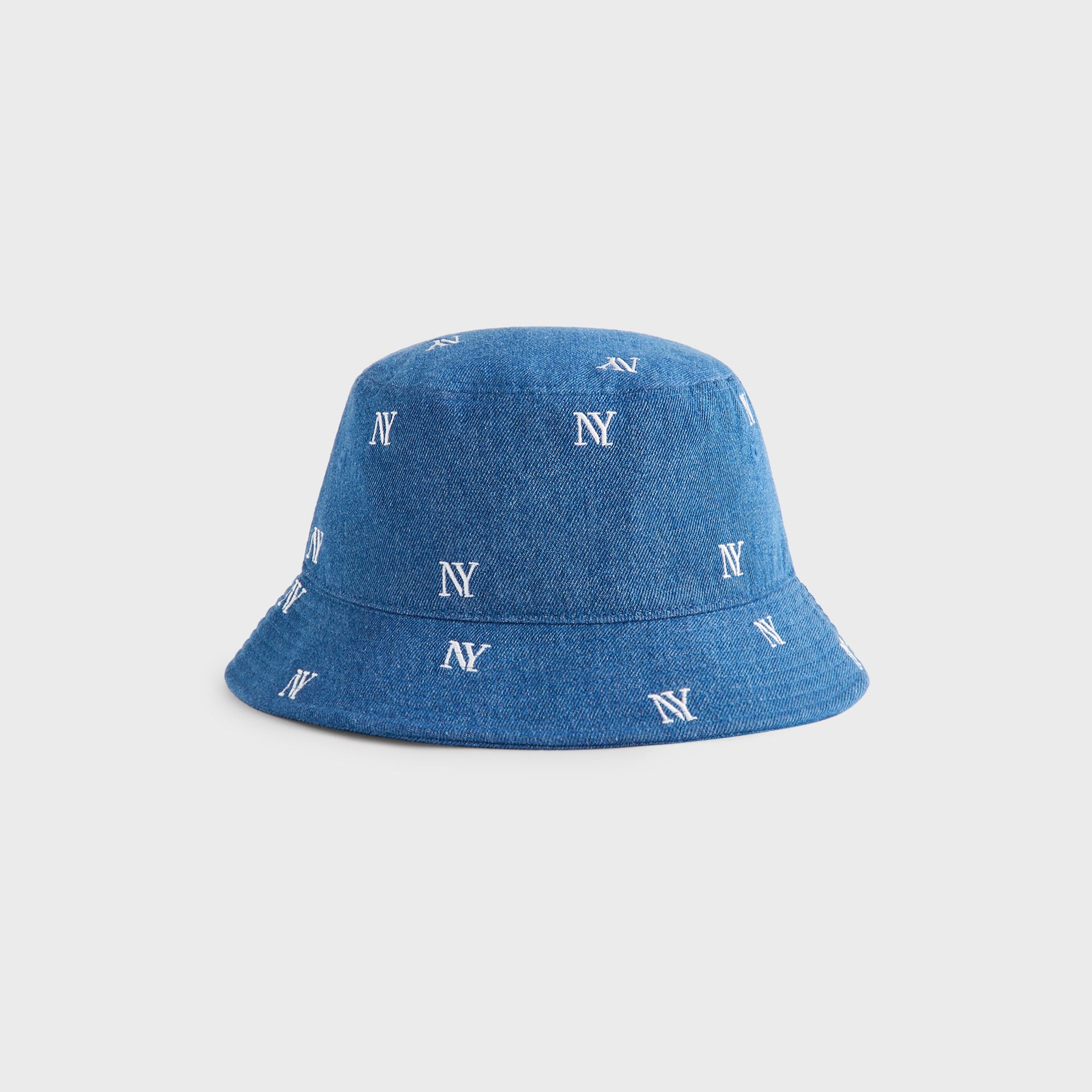 Kith NY All-Over Embroidery Dawson Bucket Hat in Medium Indigo, three-quarter angle view of the rounded crown and brim