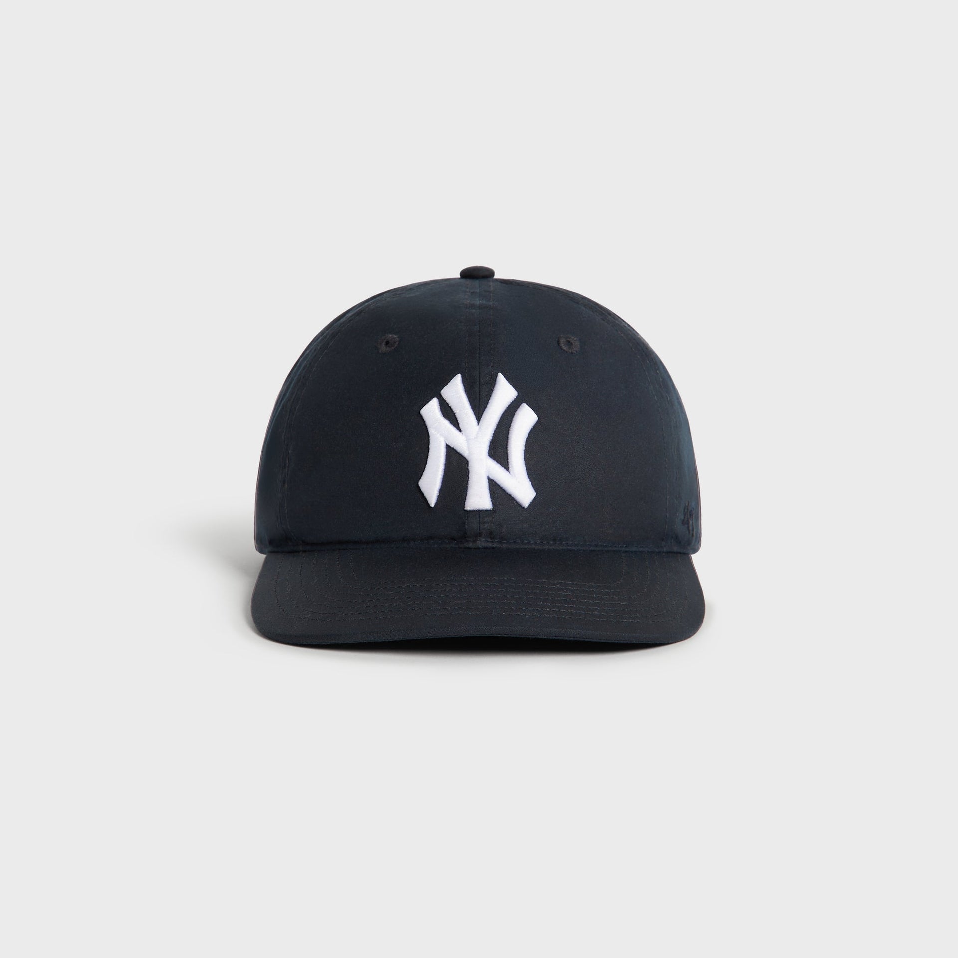 Kith & '47 New York Yankees Waxed Cotton Franchise LS Cap in nocturnal navy, front view with white NY logo